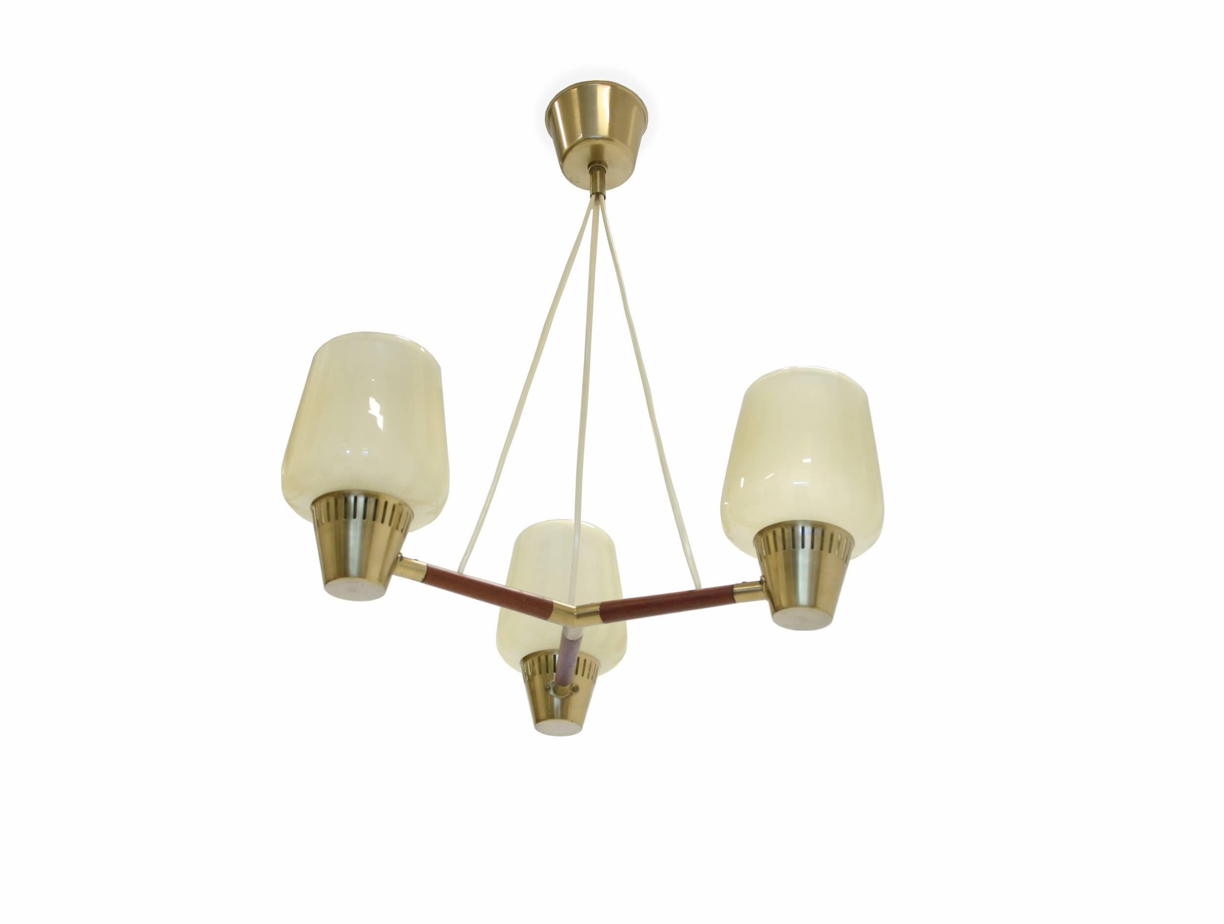 Beautiful and rare three-armed ceiling light on a teak frame and cupolas in frosted glass.

Designed and made in Sweden by ASEA, circa 1960s second half.

The lamp is fully working and in excellent vintage condition.

Complimentary world wide