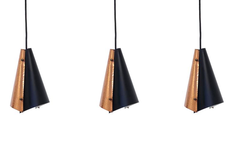 Beautiful and well-made set of three ceiling lights on a copper and painted steel frame.

Most likely designed and made in Denmark by Fog & Morup from, circa 1960s second half.

All lamps are fully working and in good vintage condition.