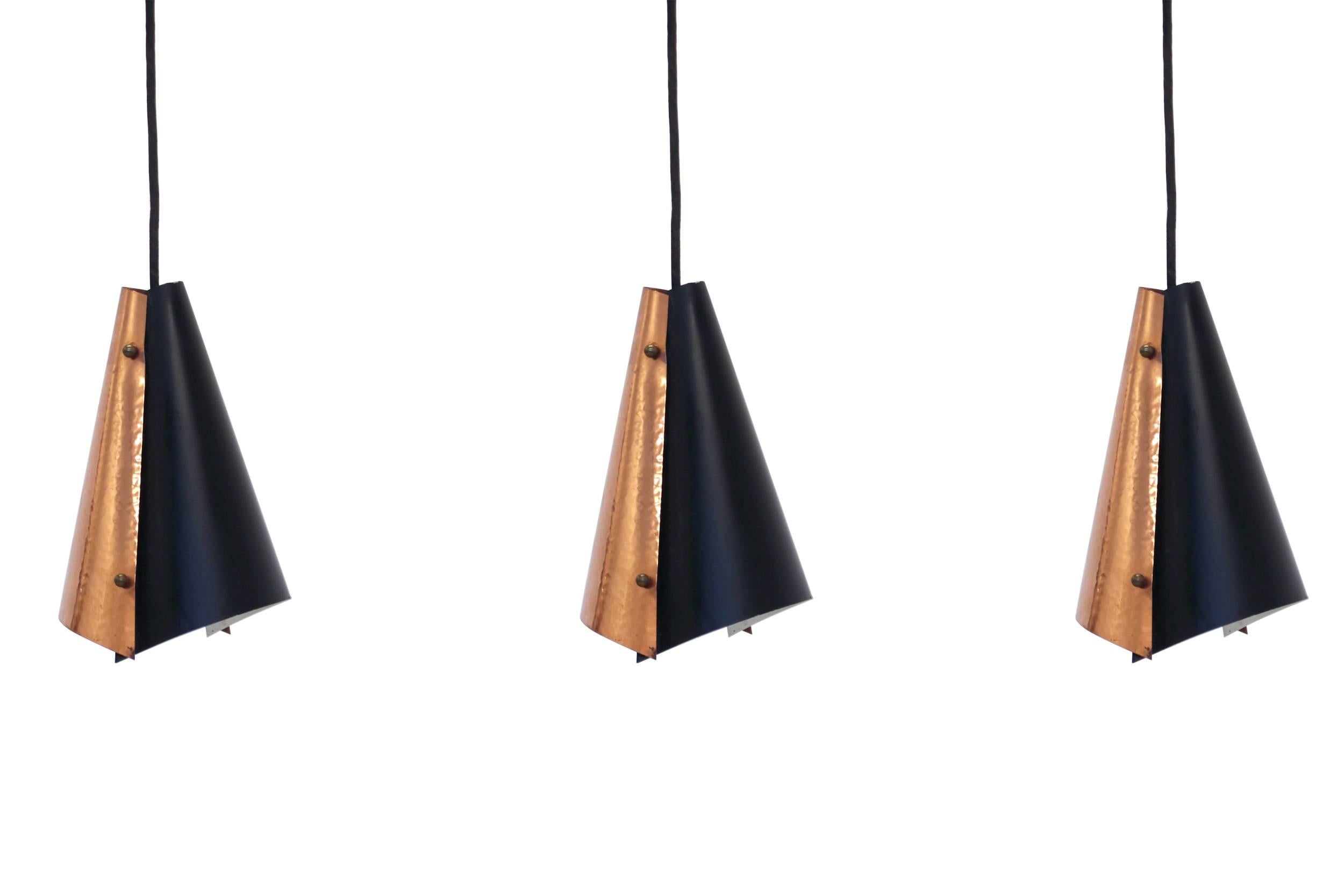 Beautiful and well-made set of three ceiling lights on a copper and painted steel frame.

Most likely designed and made in Denmark by Fog & Morup from, circa 1960s second half.

All lamps are fully working and in good vintage condition.