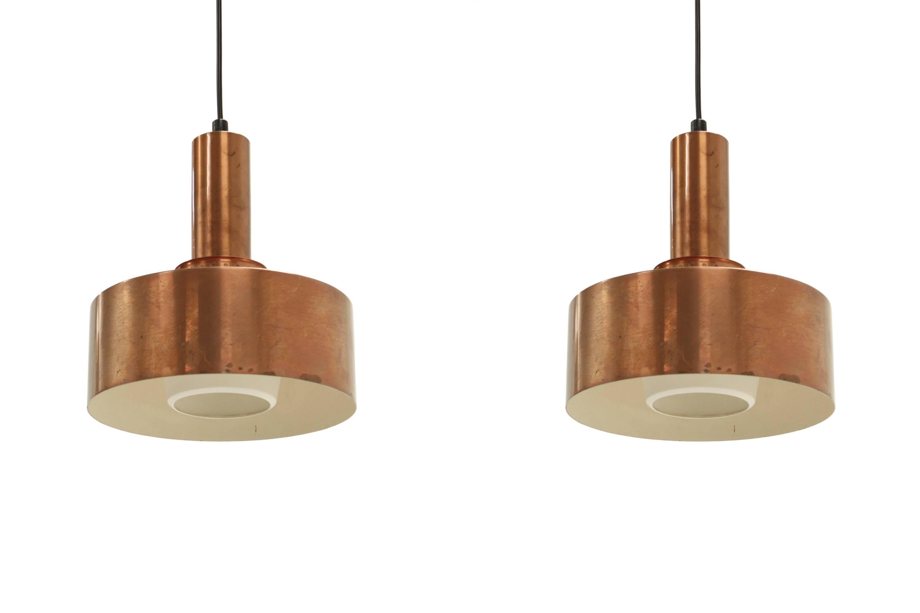 Beautiful and well made ceiling lamps on a copper frame.

Designed and made in Sweden by Hans Agne Jakobsson from 1960s second half.

Both lamps are fully working and in excellent vintage condition.

  