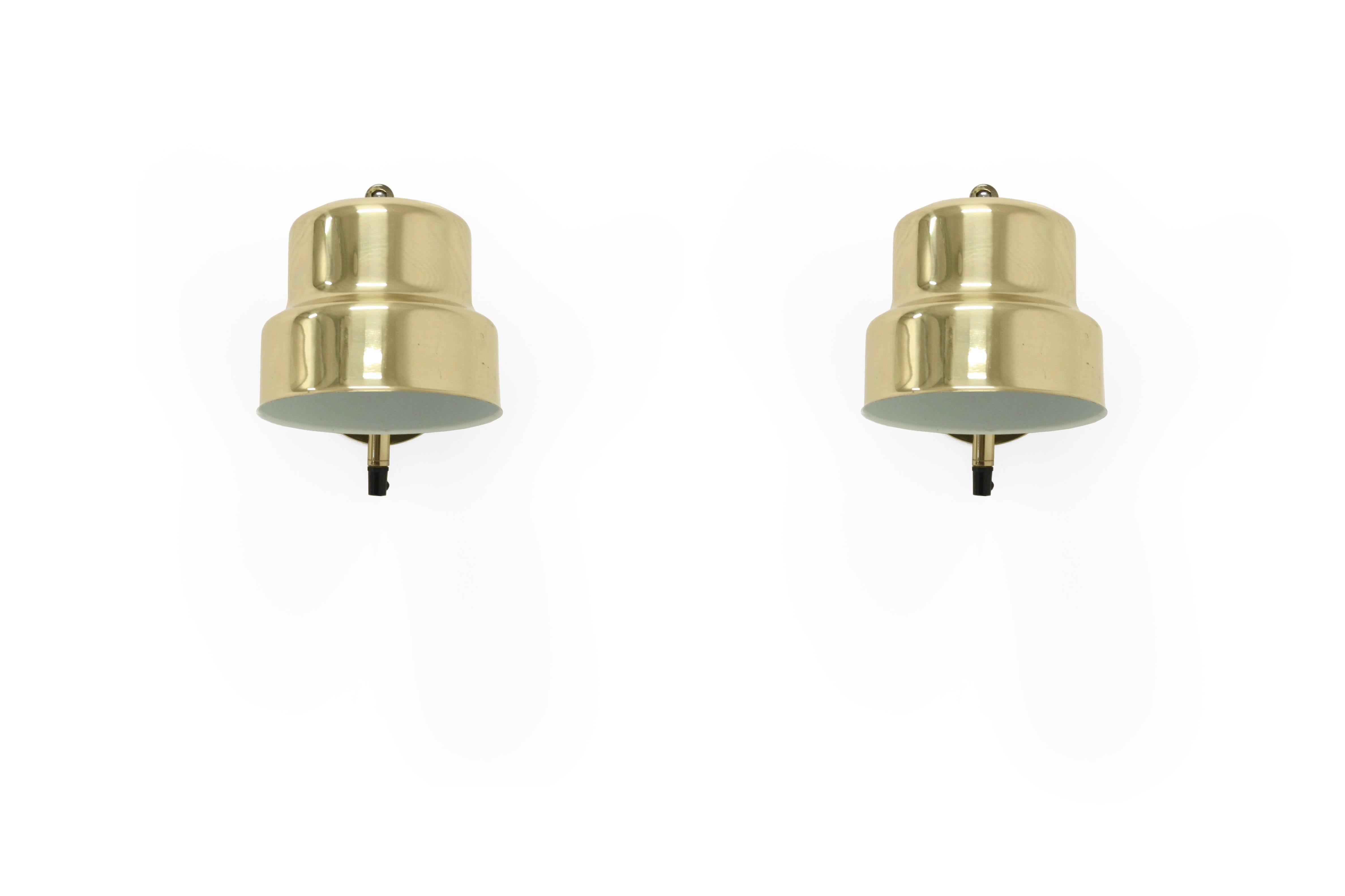 Wonderful pair of wall lights in brass. Designed and made in Denmark by ABO Randers from circa 1970s second half.

Both lamps are fully working and in excellent vintage condition. This lamps have never been used, they are part of a dead stock lot