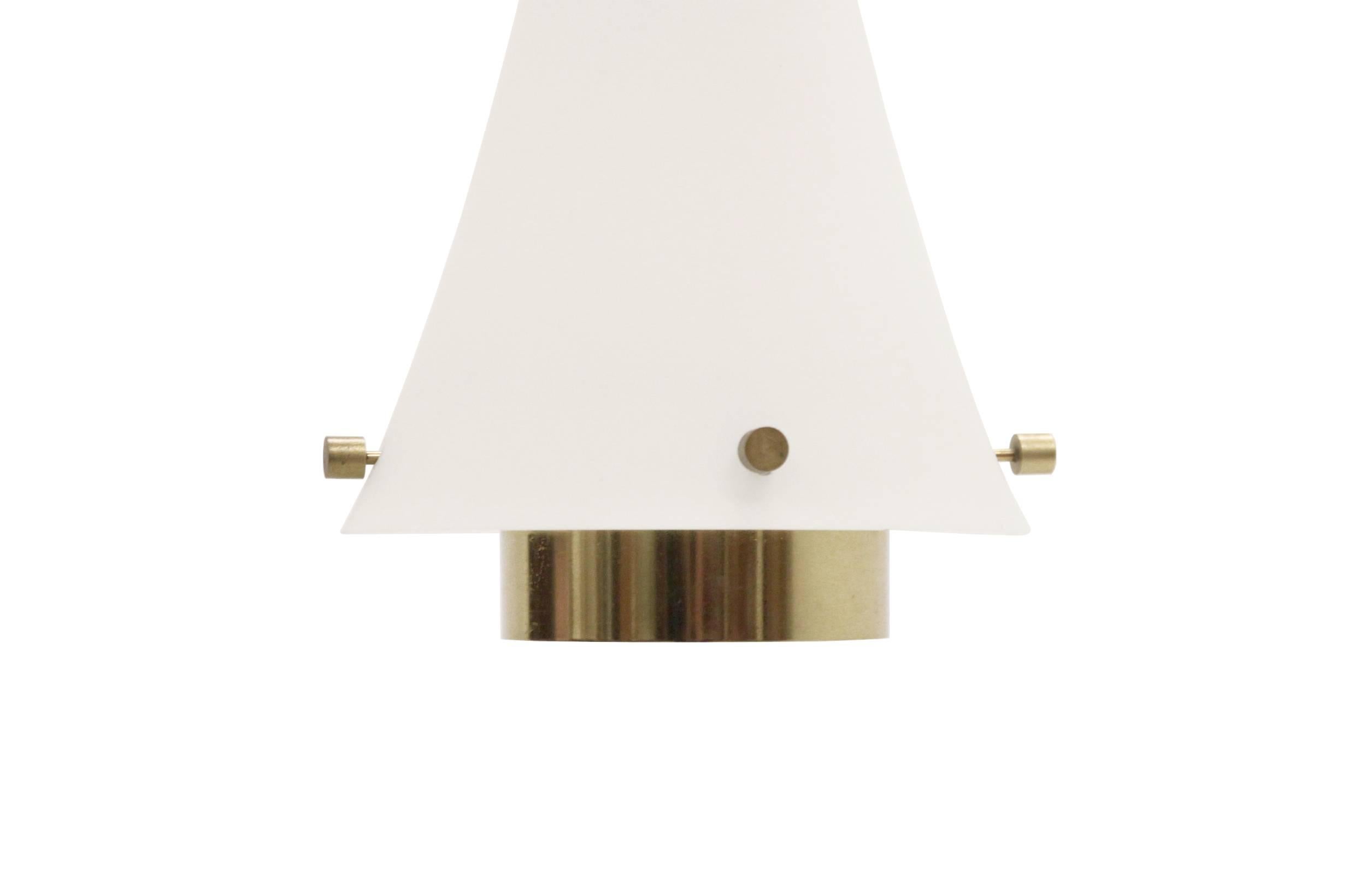 Lovely ceiling pendant in opaline glass and brass. Designed and made in Finland by Itsu from circa 1960s second half.

The pendant is fully working and in good vintage condition.

 