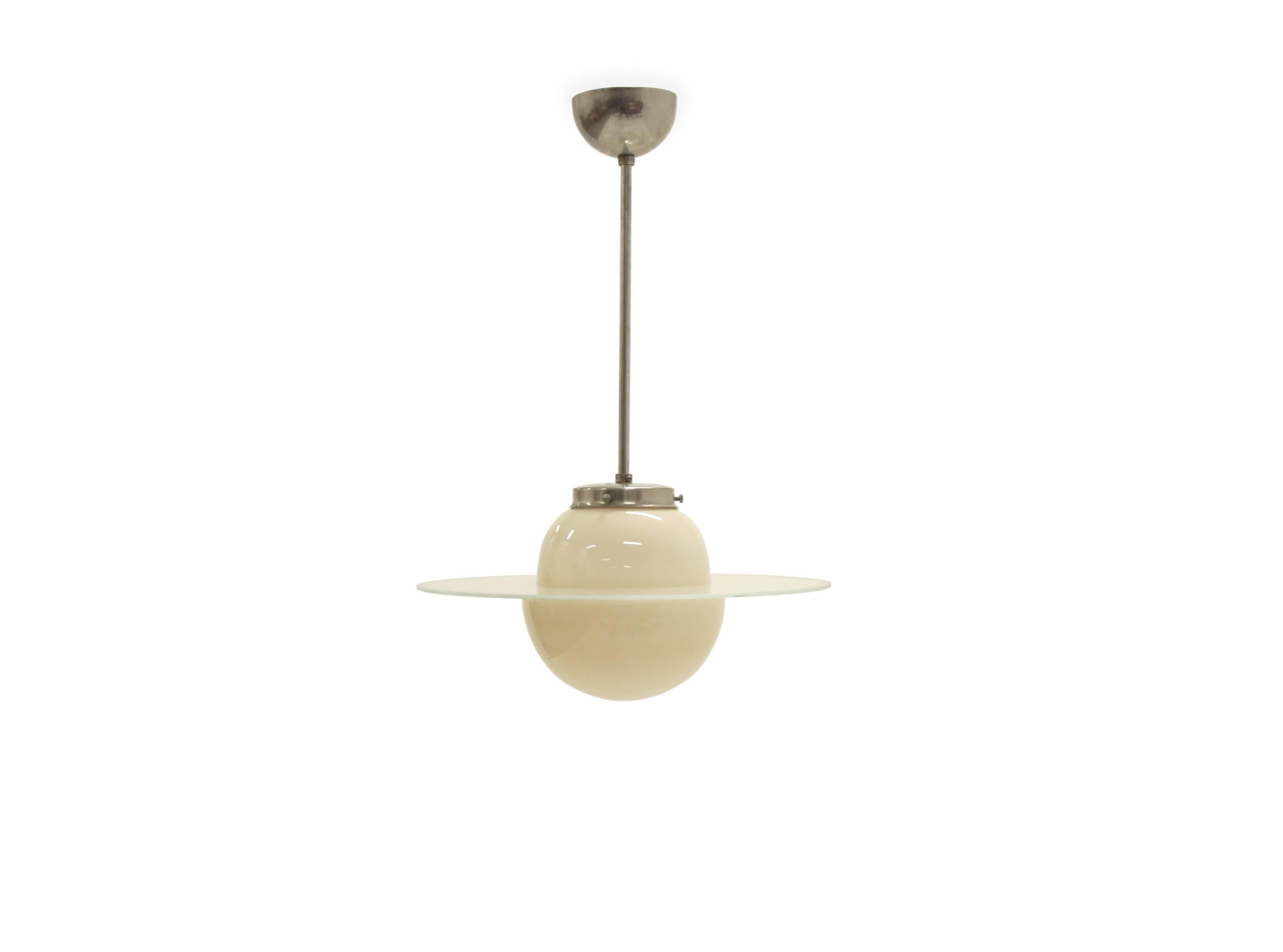 Wonderful and dreamy ceiling lamp on a chrome steel frame and shade in opaline glass with a circular Saturn ring in frosted glass.
 
Most likely designed and made in Sweden, circa 1930s second half.
 
The lamp is fully working and in excellent