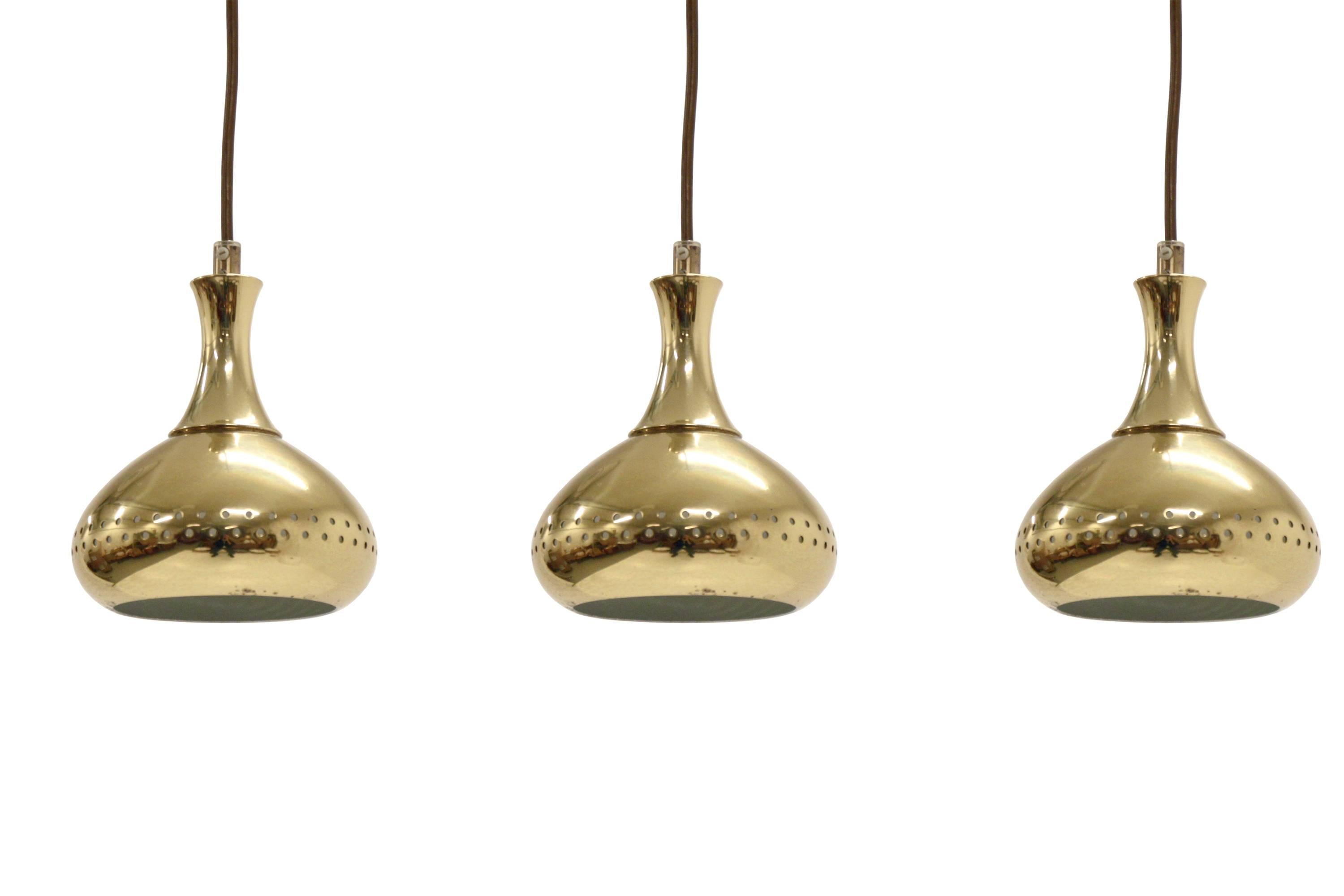 Set of seven drop shaped ceiling pendants on a brass frame.

Attributed to Hans Agne Jakobsson from circa 1960s second half.

All lamps are very well made and fully working. They are in good vintage condition with minor wear.