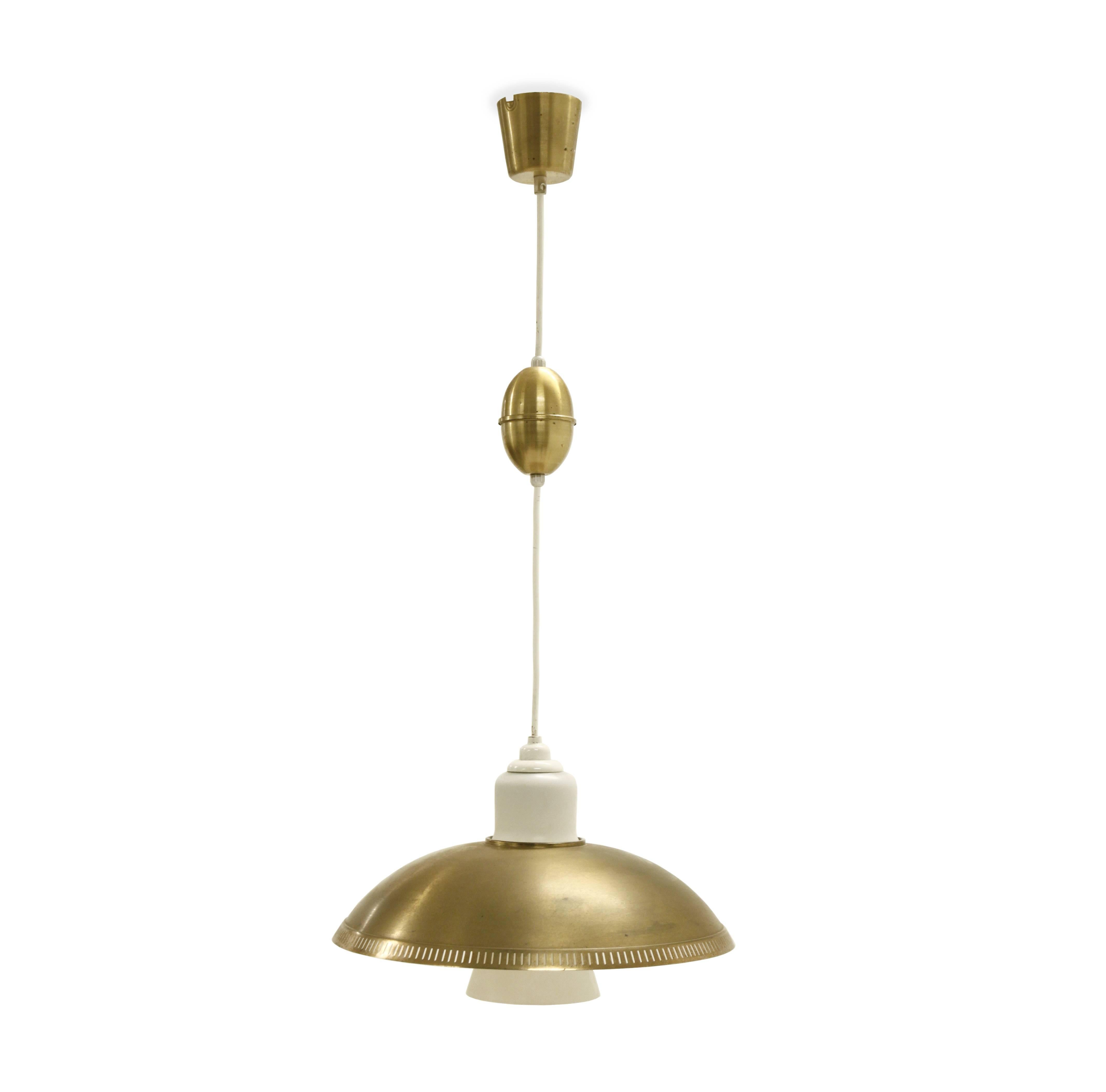 Wonderful and modernist ceiling light in brass and opaline glass.

Designed by Bengt Karlby and made in Denmark by Lyfa from circa 1960s first half.

The lamp is fully working and in good vintage condition.

Fixture height: 30.