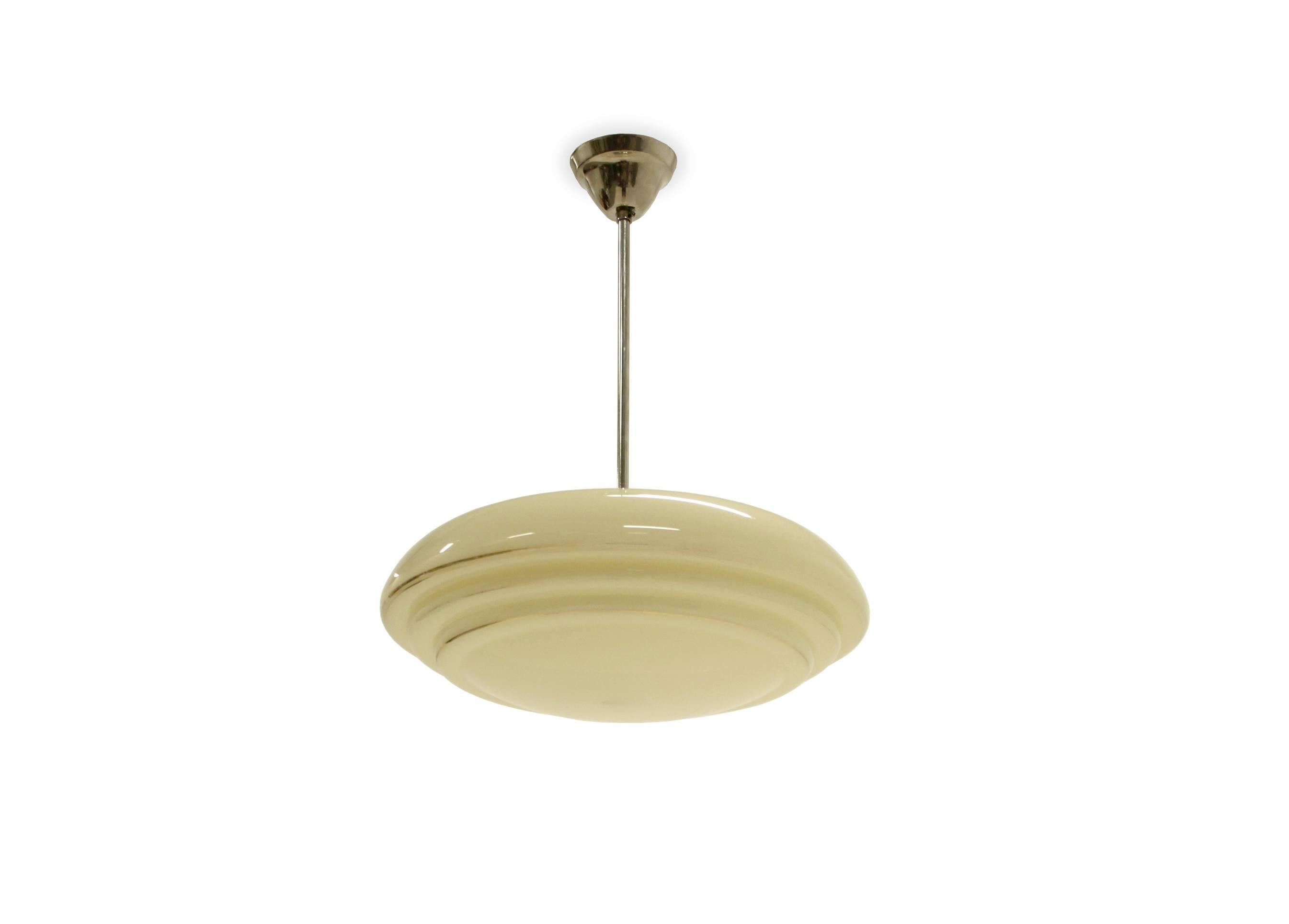 Circular ceiling lamp in opaline glass and stem in chrome.

Designed and made in Norway by T. Røste & Co, circa 1950s second half.

The lamp is fully working and in good vintage conditon with normal wear.
 