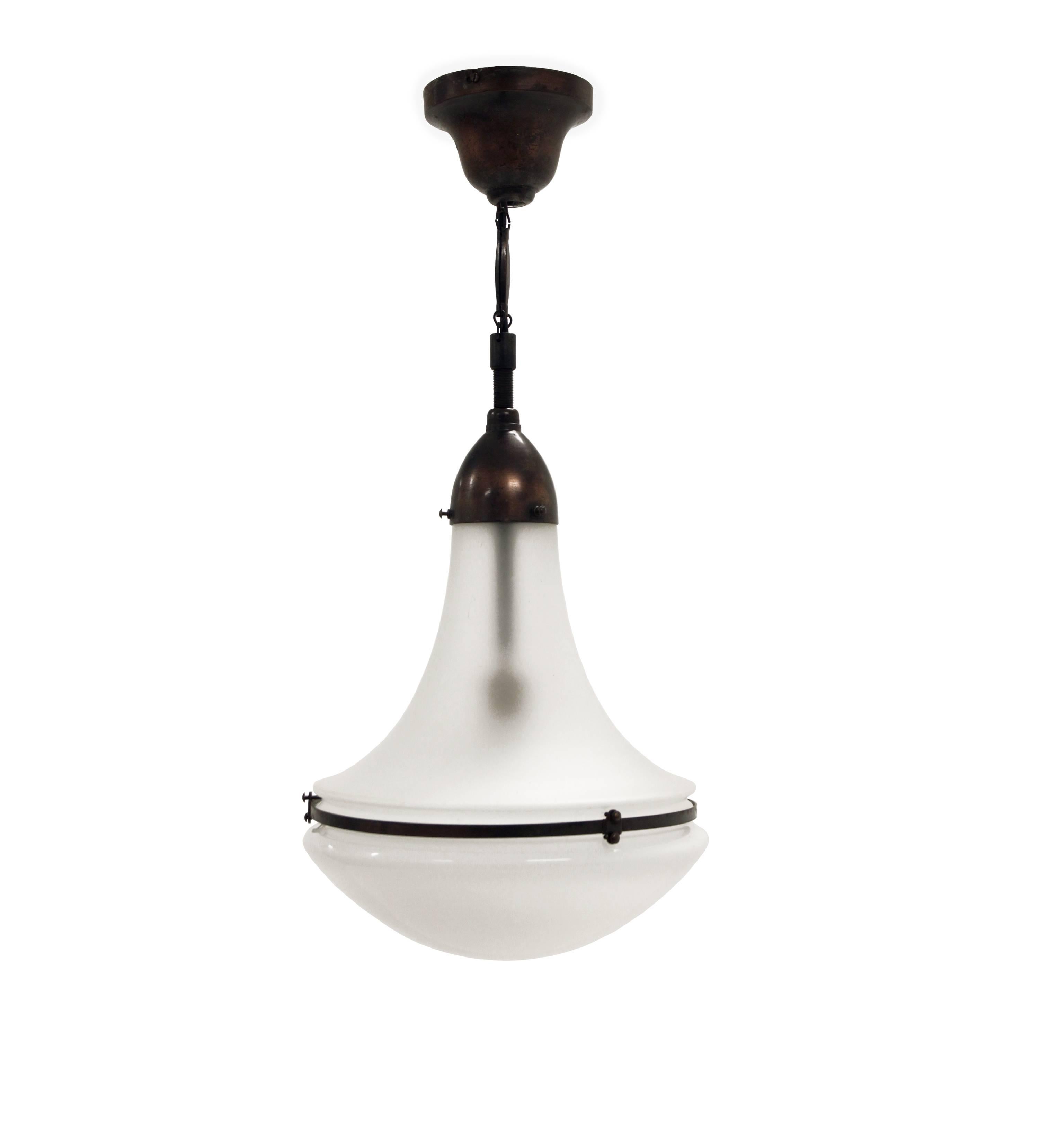 Iconic ceiling lamp on a metal frame with frosted glass and opaline glass shade.

Model 'Luzette'. Designed by Peter Behrens and made in Germany by Siemens from 1910. 

The lamp have been rewired and fully working. Only normal and minor age