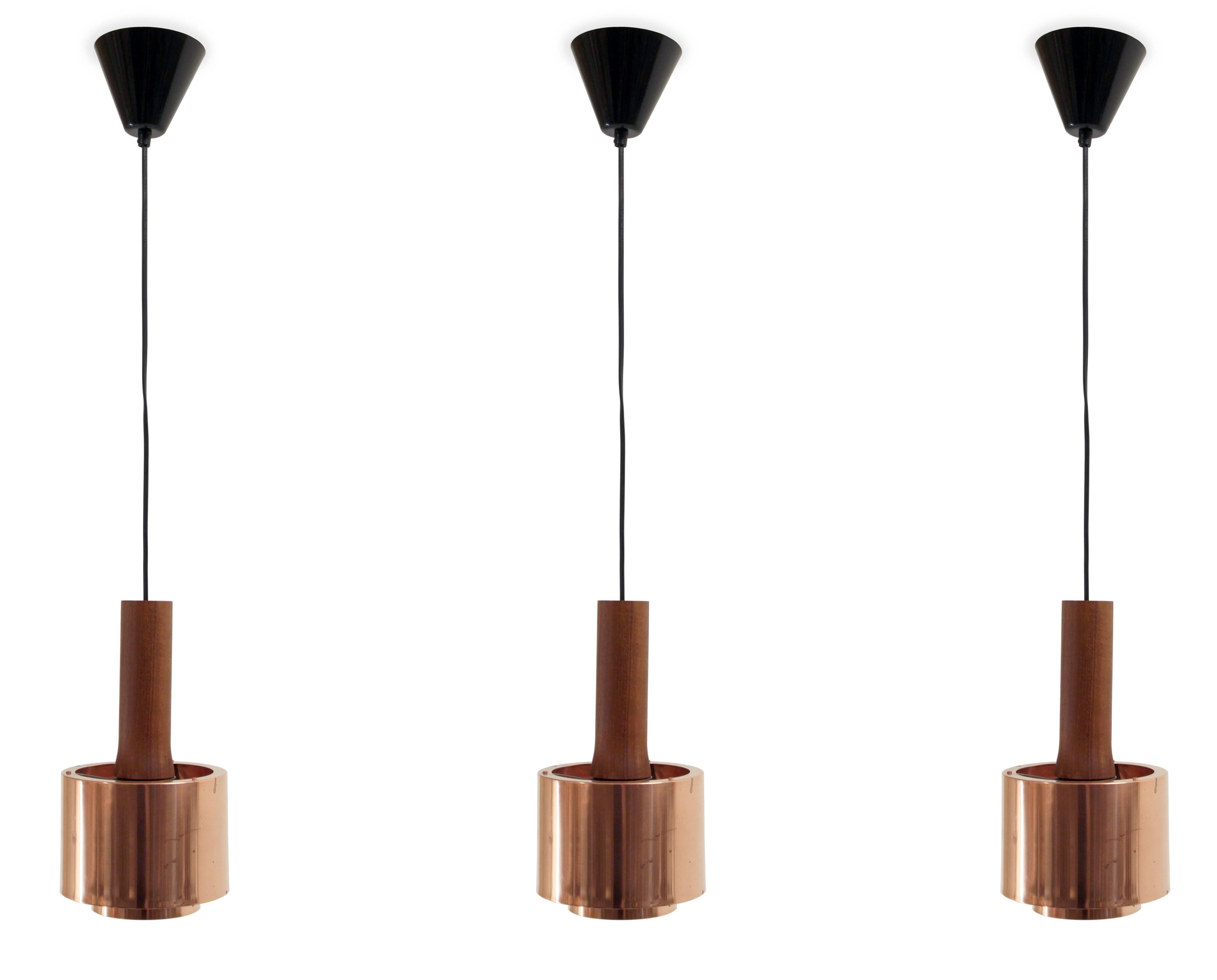 Wonderful set of ceiling lights in copper and teak.

Most likely designed and made in Sweden from circa 1960s second half. 

All lamps are fully working and in excellent vintage condition. 

Wire length 86cm.