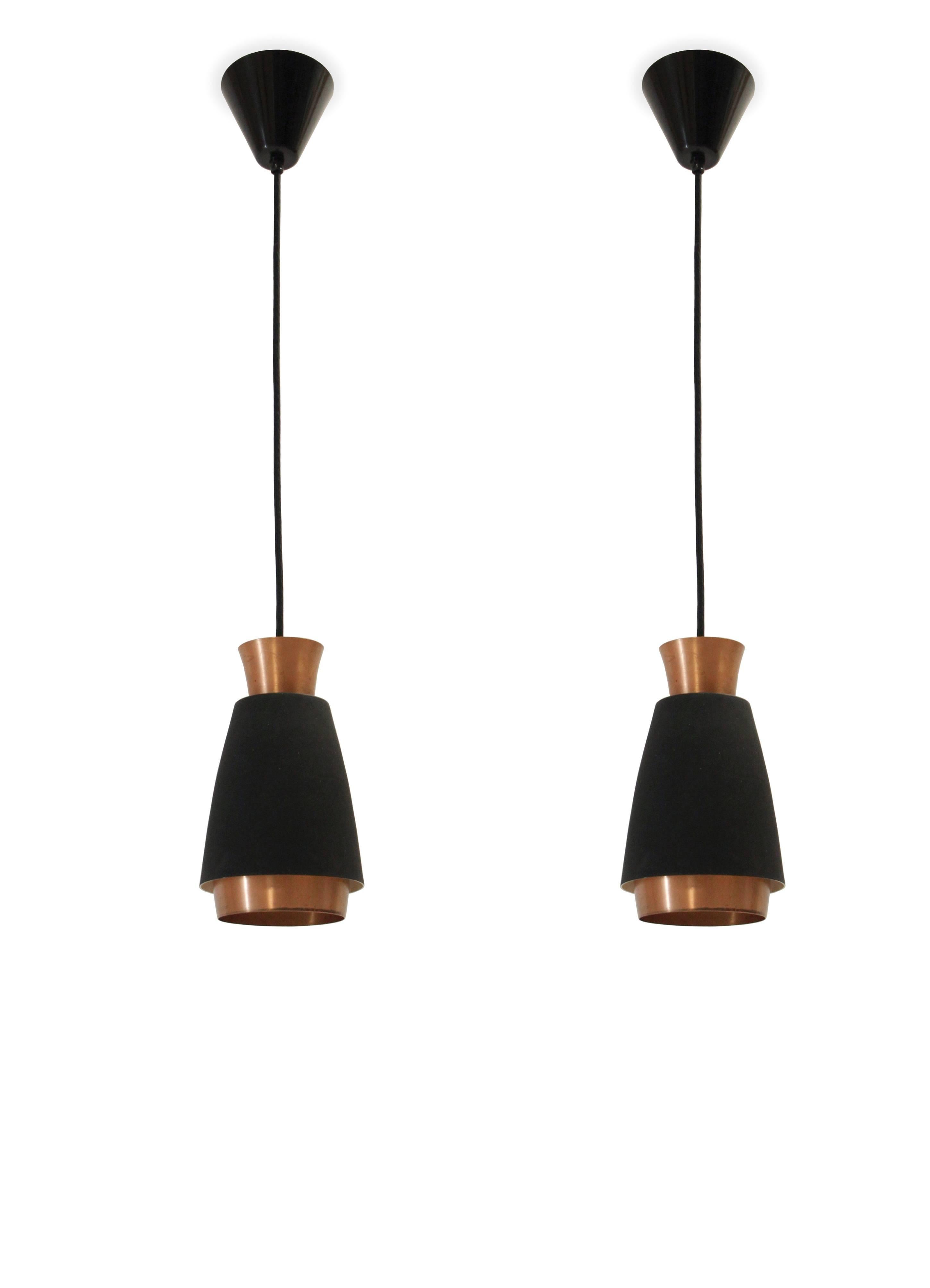 Wonderful pair of ceiling pendant in powder coated steel and copper.

Most likely designed and made in Norway from circa 1960s second half.

Both lamps are fully working and in excellent vintage condition.

Wire length 85cm.