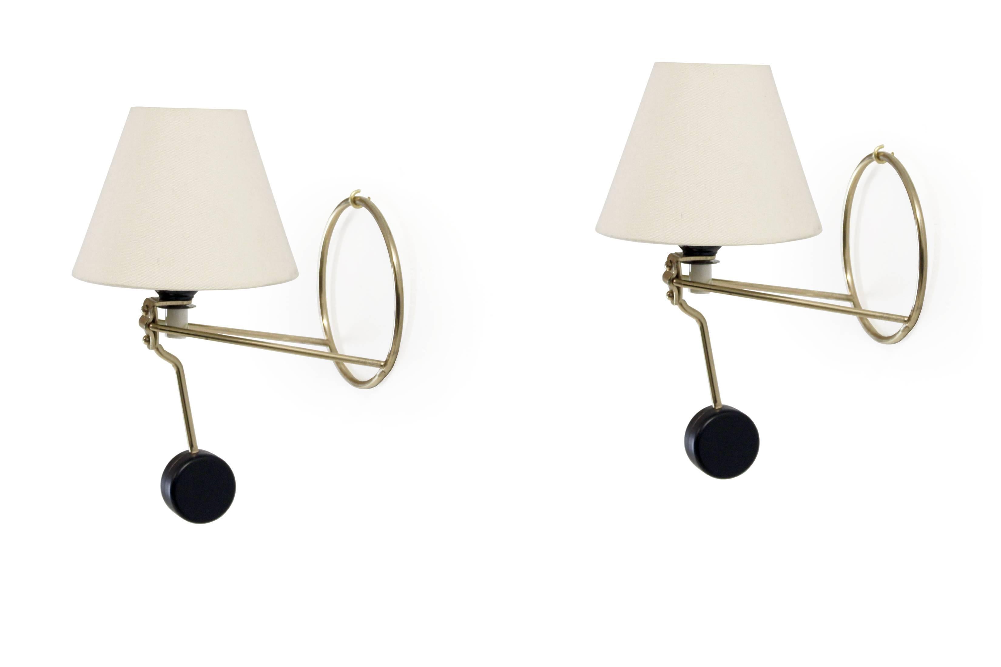 Rare and decorative and set of wall lights in brass and steel. Designed by Anders Pehrson and made in Sweden from second half of circa 1960. Both lamps are fully working and in excellent vintage condition.