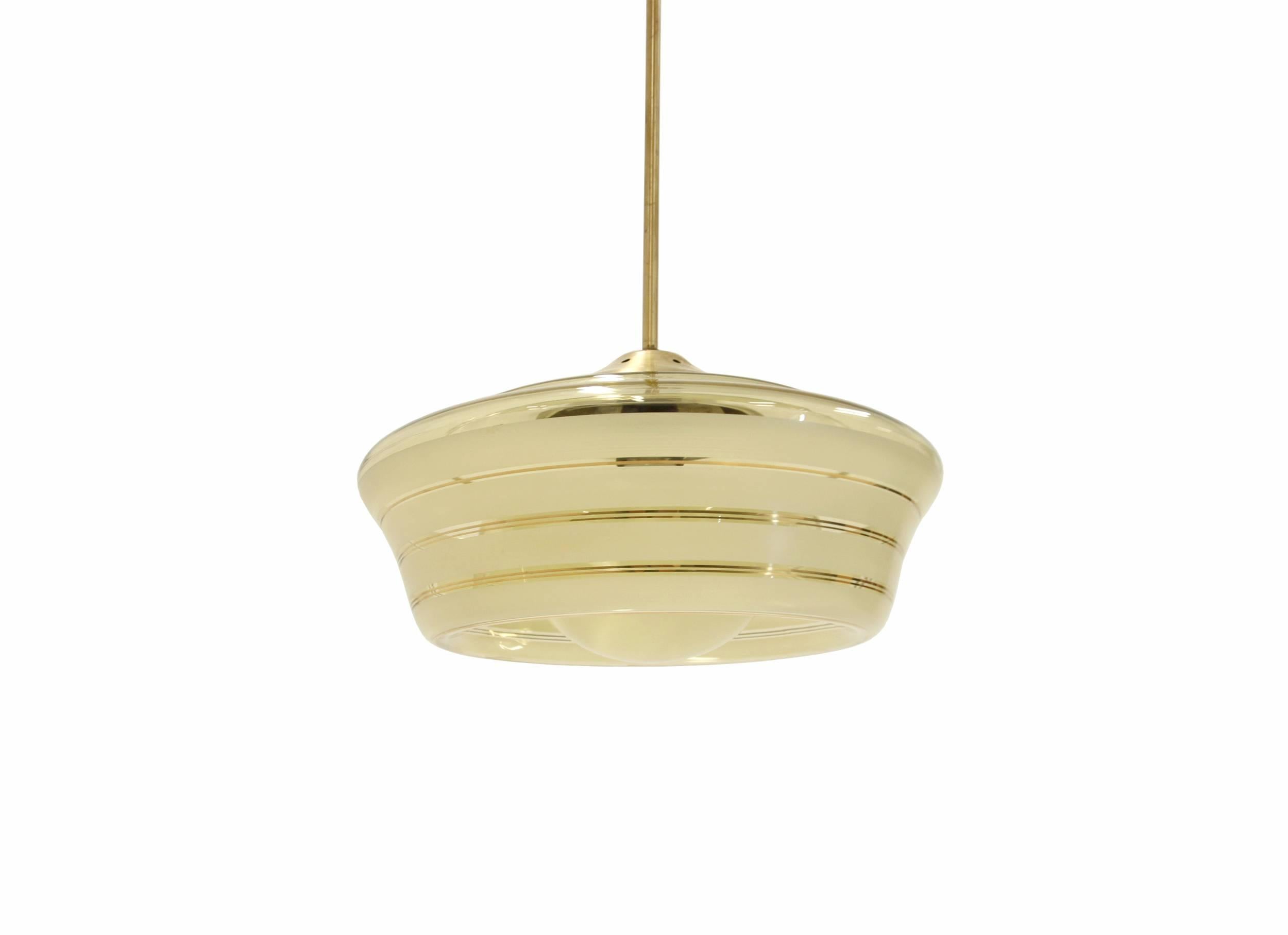 Expressive ceiling light with a surface decorated glass shade and brass stem. The lamp is from the 1930s and this particular piece is most likely designed and manufactured in Norway by P.C.P. The lamp is fully working and in very good vintage