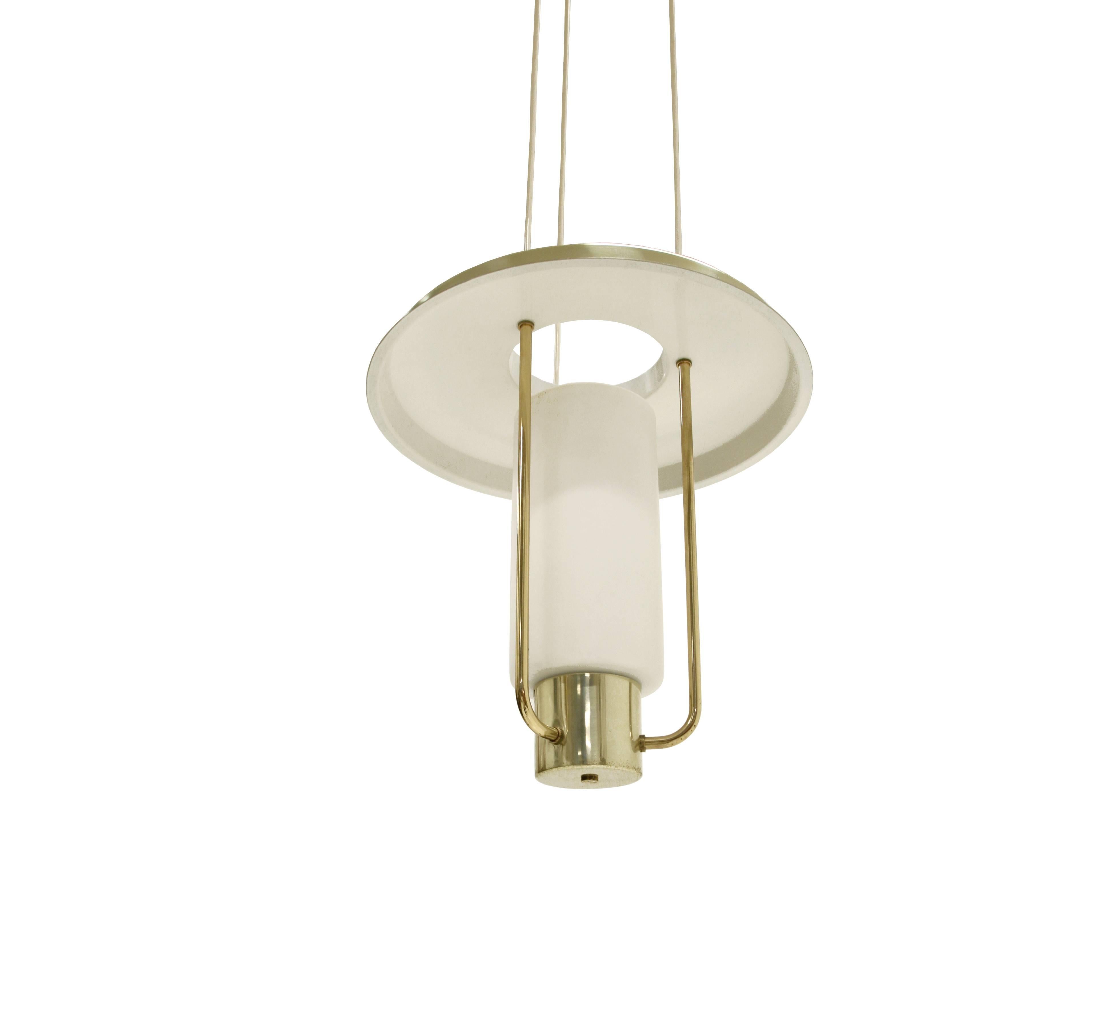 Refreshing and expressive ceiling lamp on a brass frame and shade in opaline glass shade. This is model 'T-825'. Designed and made by Hans Agne Jakobsson in Sweden from, circa 1960s second half. The lamp is fitted with one E27 bulb holder (works in