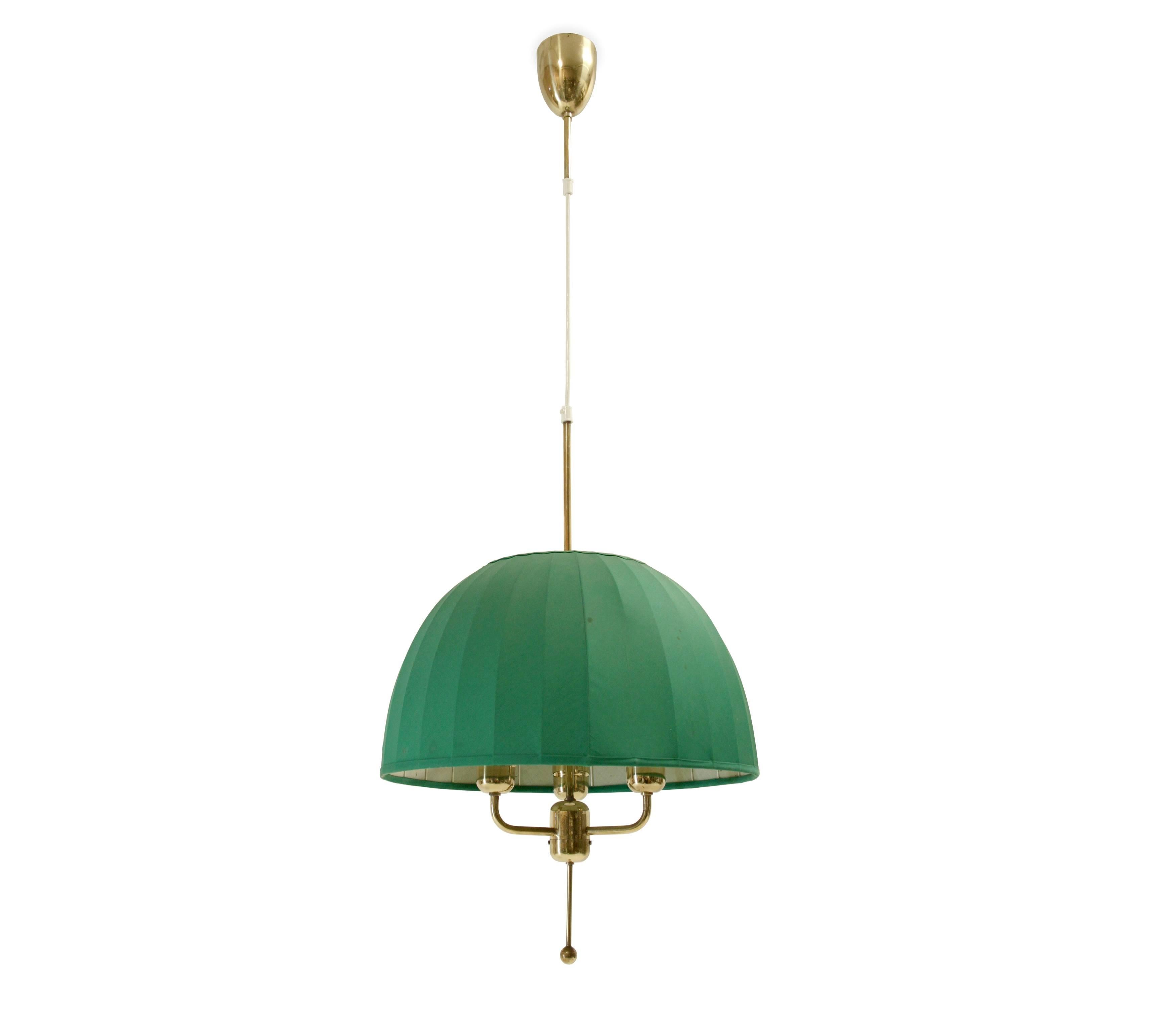 Wonderful three-armed chandelier in brass with original shade. This is model T549. Designed and made in Sweden by Hans-Agne Jakobsson from circa 1970 second half. The lamp is in good vintage condition with some age related usage marks.
 
