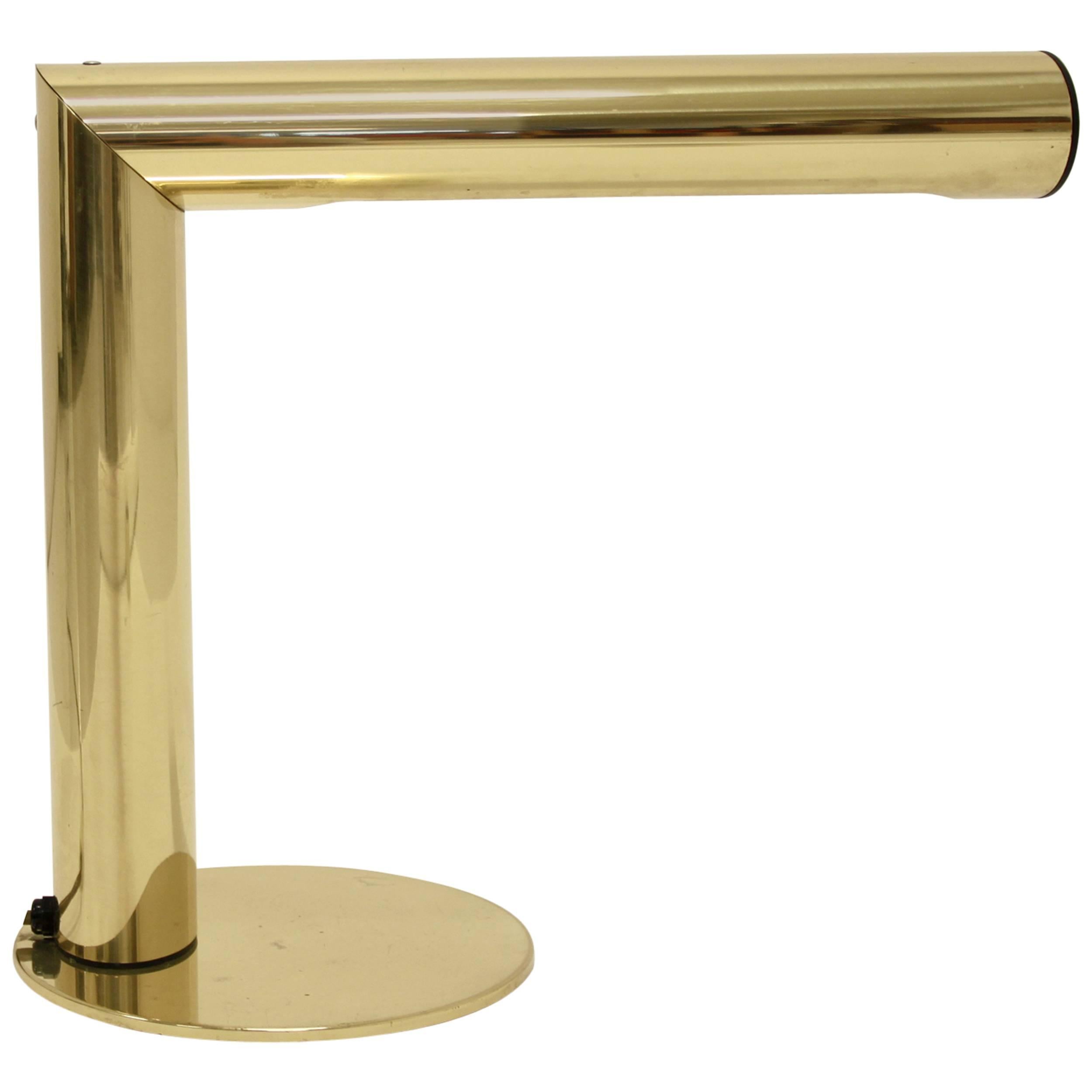 Wonderful and minimalist table lamp on a brass frame with revolving lampshade. Designed by Jonas Hidle and made by Høvik Lys AS, Norway, circa 1980 second half. The lamp is a remarkable example of Norwegian post modernist design produced in a short
