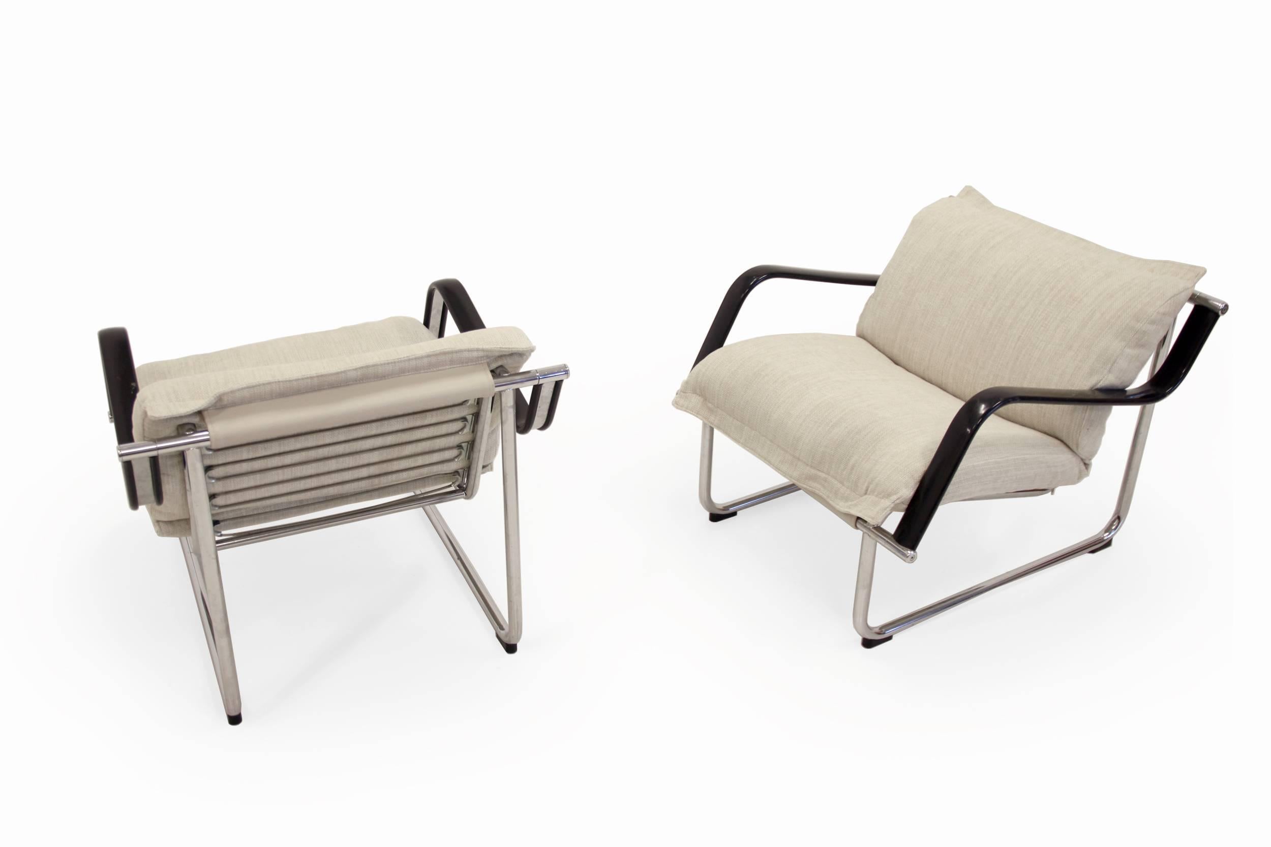 Modern and Minimalist pair of lounge chairs on a chrome steel frame with new pillows and upholstery in wool. This is model 'Remmi'. Designed by Yrjö Kukkapuroand manufactured in Finland by Avarte. Both chairs have a sturdy framework with some minor