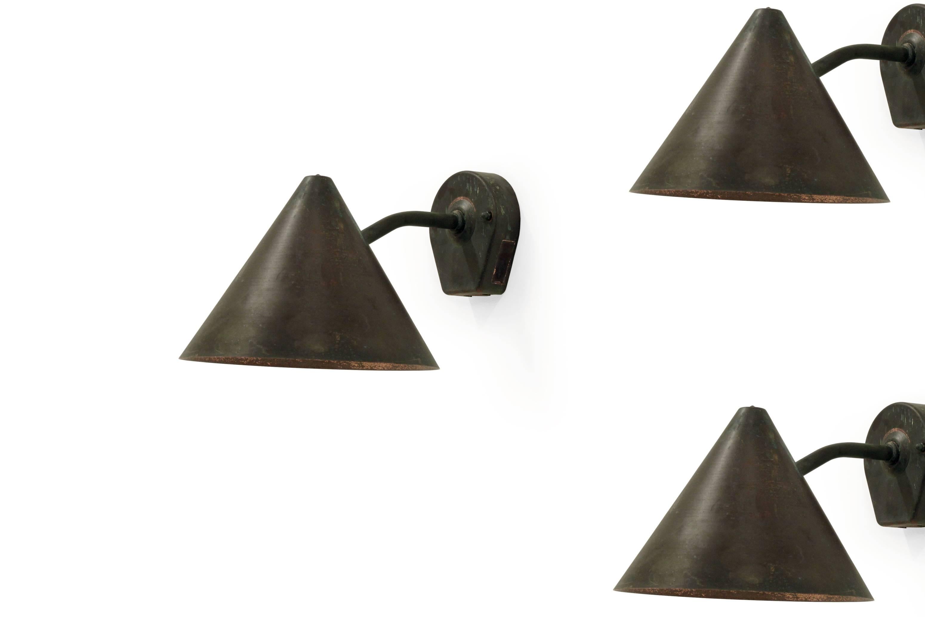 Set of three outdoor wall lights in patinated copper.

Designed and made in Sweden by Falkenbergs Belysning around the late 1960s.

The lamps are fully working and in good vintage condition.