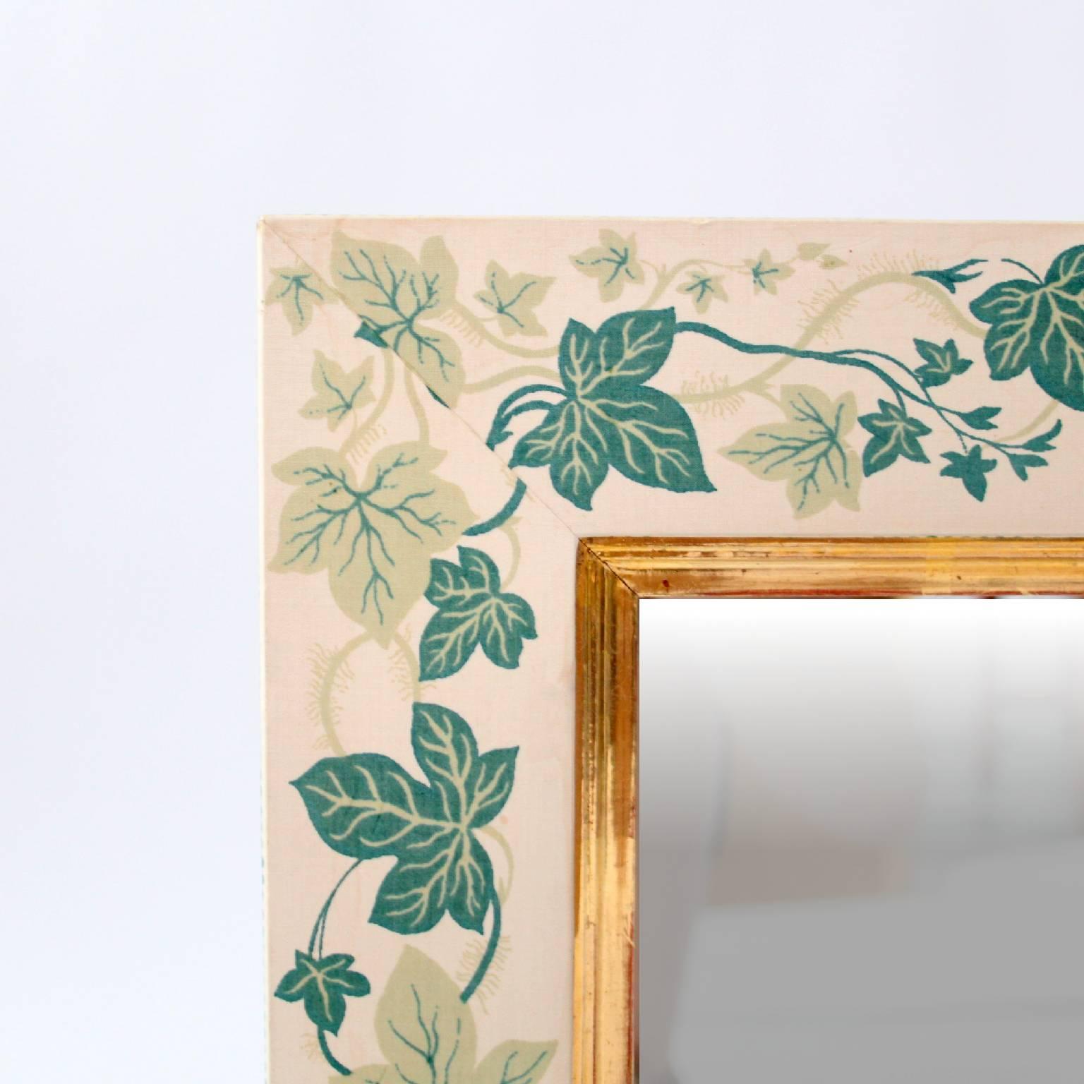 ESTRID ERICSON AND SVENSKT TENN   -   SCANDINAVIAN MODERN

A beautiful linen covered mirror by the Swedish pioneer in design, Estrid Ericson.

The linen covered frame is decorated with ivy leaves. Gilded detail along the inner edge of the