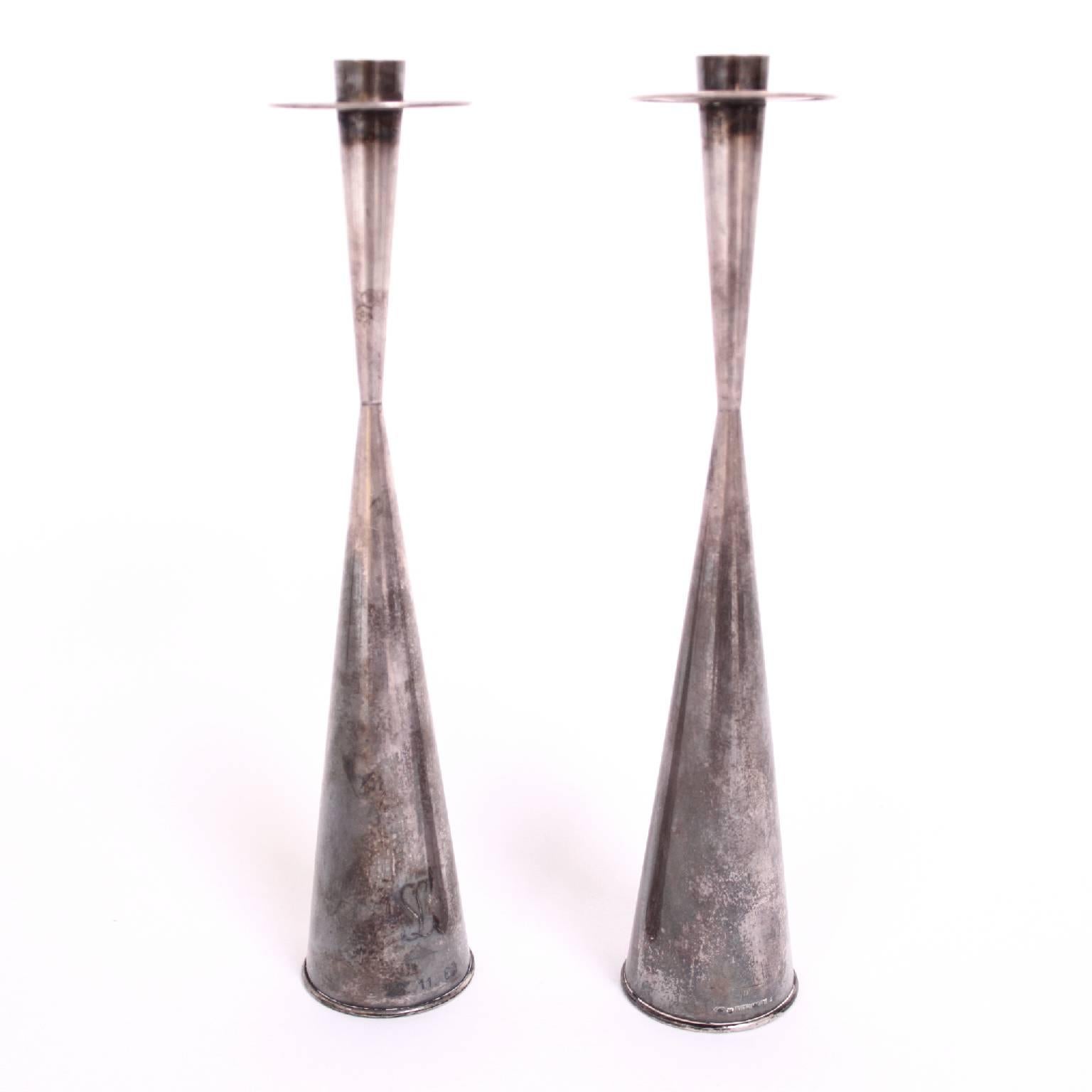 TAPIO WIRKKALA - SCANDINAVIAN MODERN

A beautiful pair of silver candlesticks, model no. 89, were designed in 1957 by the famous Finnish multi designer Tapio Wirkkala. 

Artist signature and silver stamps.

Each incised with 