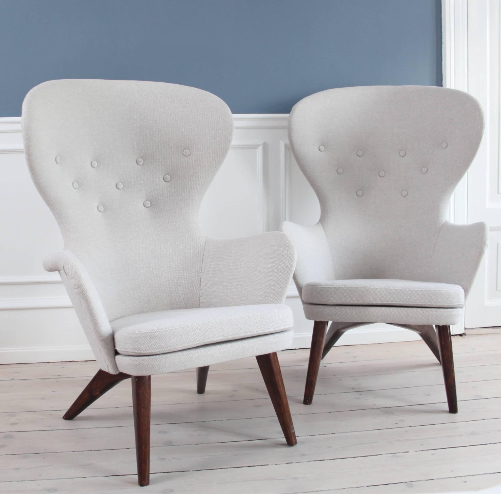 Pair of high back armchairs designed by Carl Gustav Hiort af Ornäs.

Stained wood and wool upholstery in Kvadrat.

Designed and manufactured by Hiort af Ornäs, Finland, 1950s.
 
Stamped ”Hiort Tuote Puunveiosto Helsinki