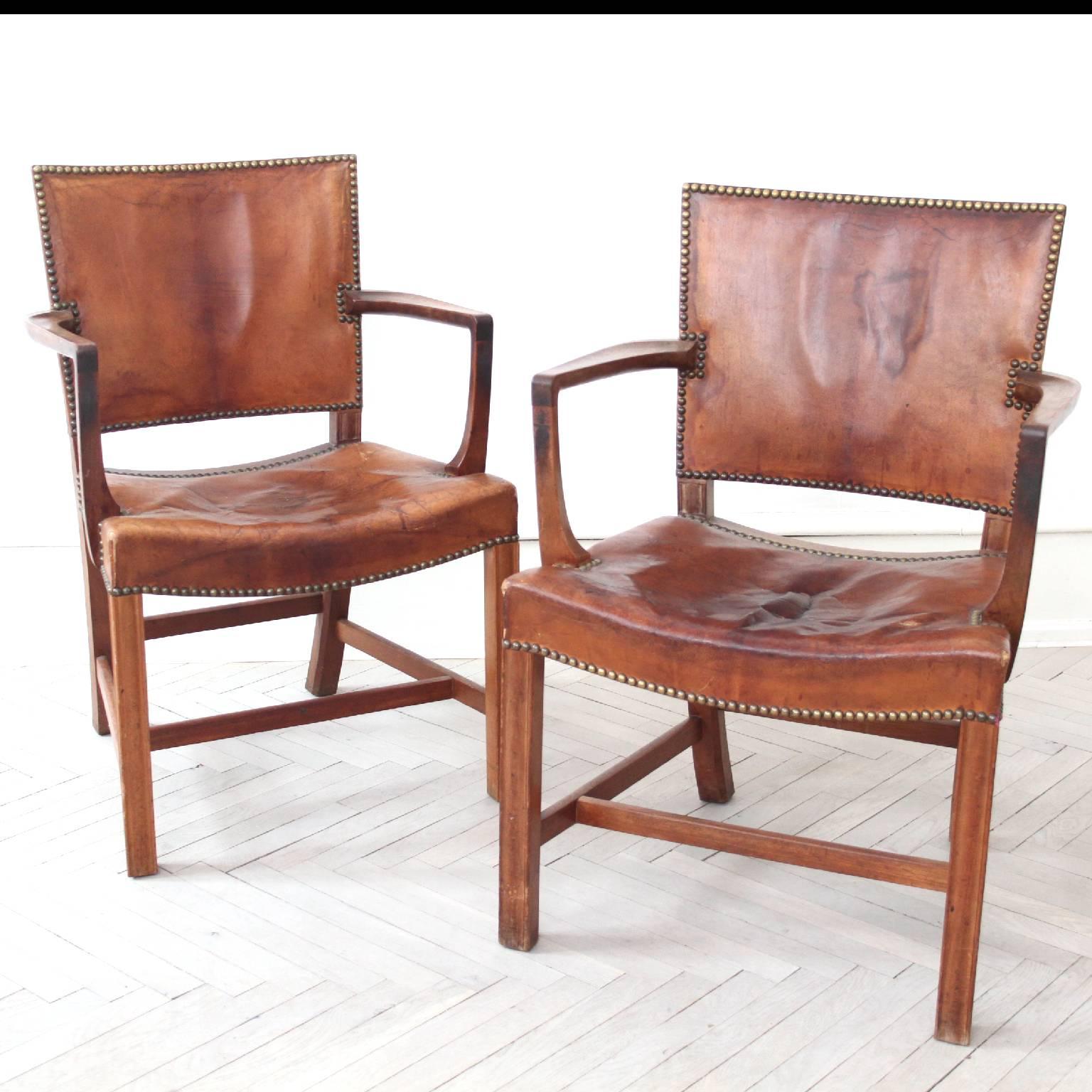 An early pair of Cuban mahogany armchairs designed by Kaare Klint and manufactured by Rud Rasmussen. The 