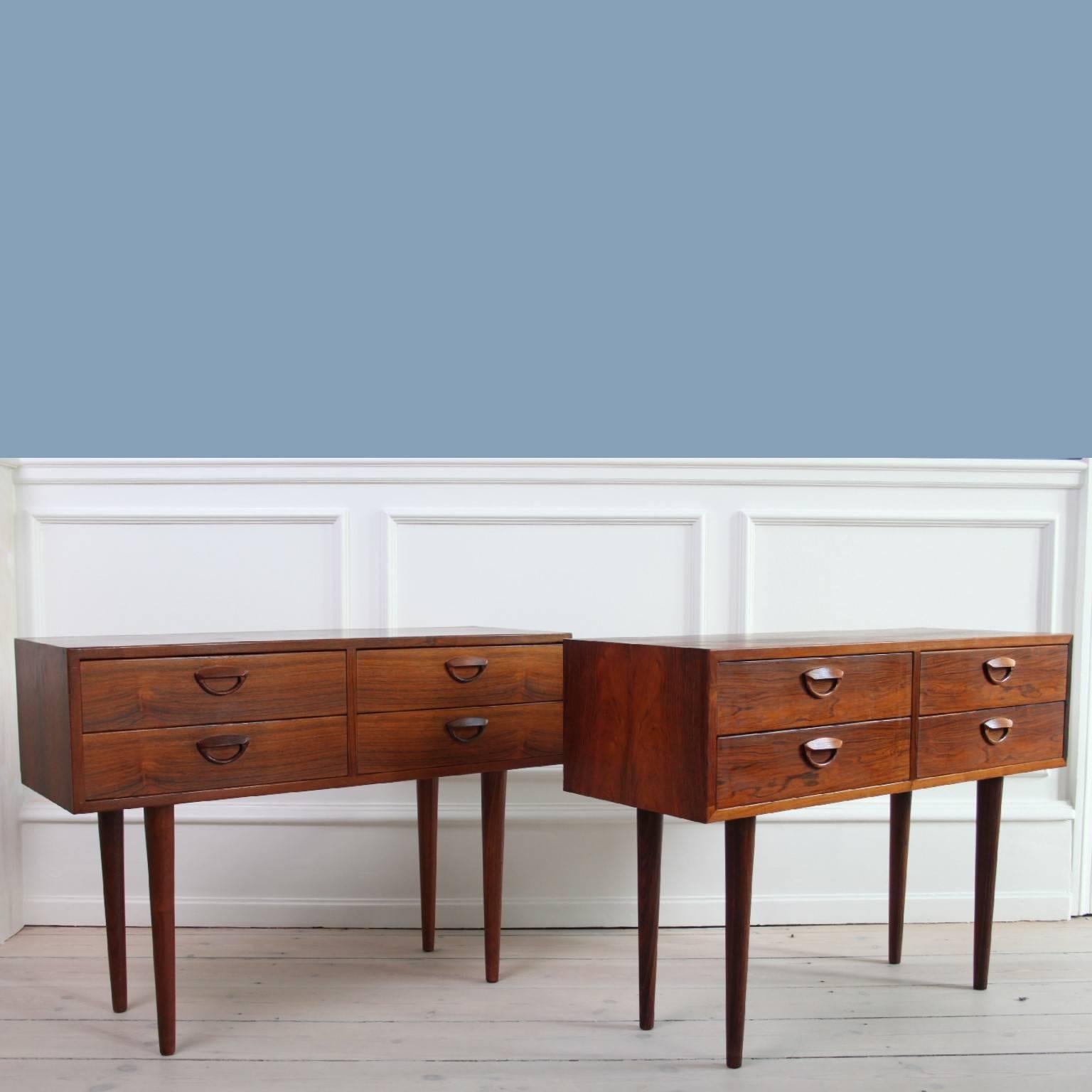 Pair of bedside tables designed by Kai Kristiansen.

Front with four drawers featuring sculpted handles.

Manufactured by Feldballes Furniture, 1960s.

Made of Brazilian rosewood.

Excellent original vintage condition.

CITES- certificate