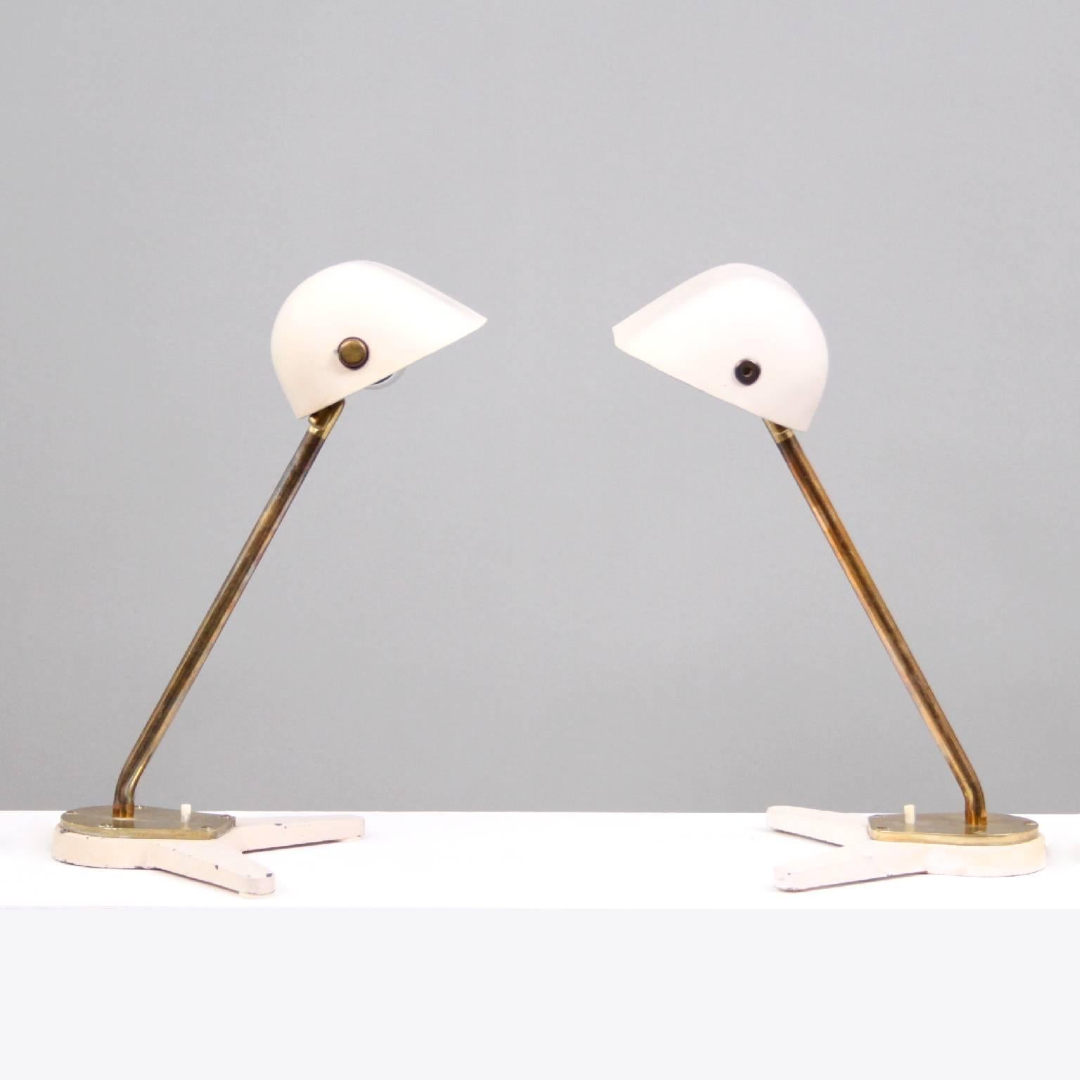 A rare pair of desk lamps designed by Arne Jacobsen & Hans J. Wegner for Aarhus City Hall, 1938-1941.

Original white lacquered adjustable shade and base, adjustable brass stem and foot, white bakelite push button switch. 

Manufactured 1940s by