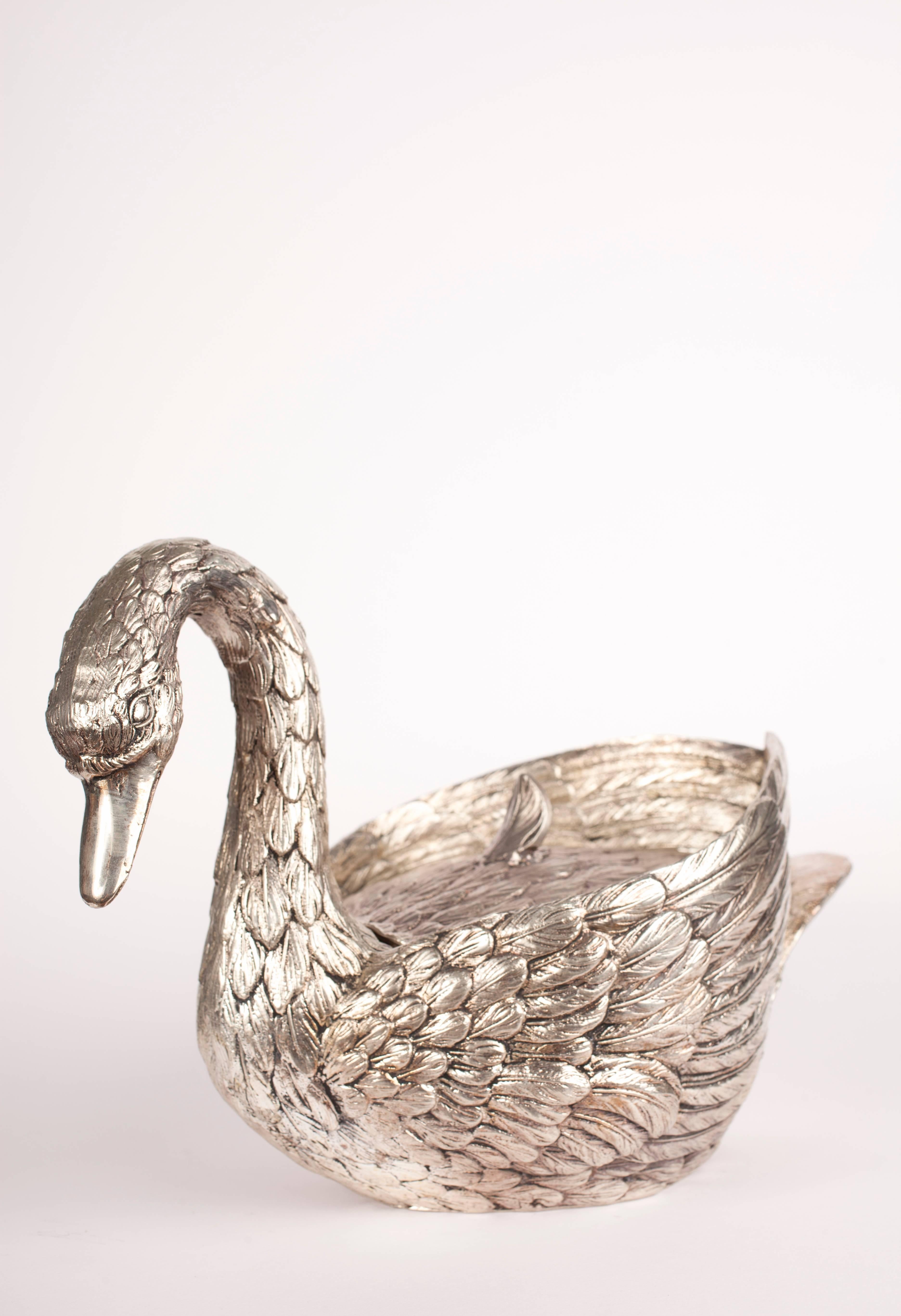Beautiful ice bucket by Mauro Manetti in the form of a swan, expertly cast in metal and silver plated with a plastic ice tray. The condition is fantastic commensurate with age.