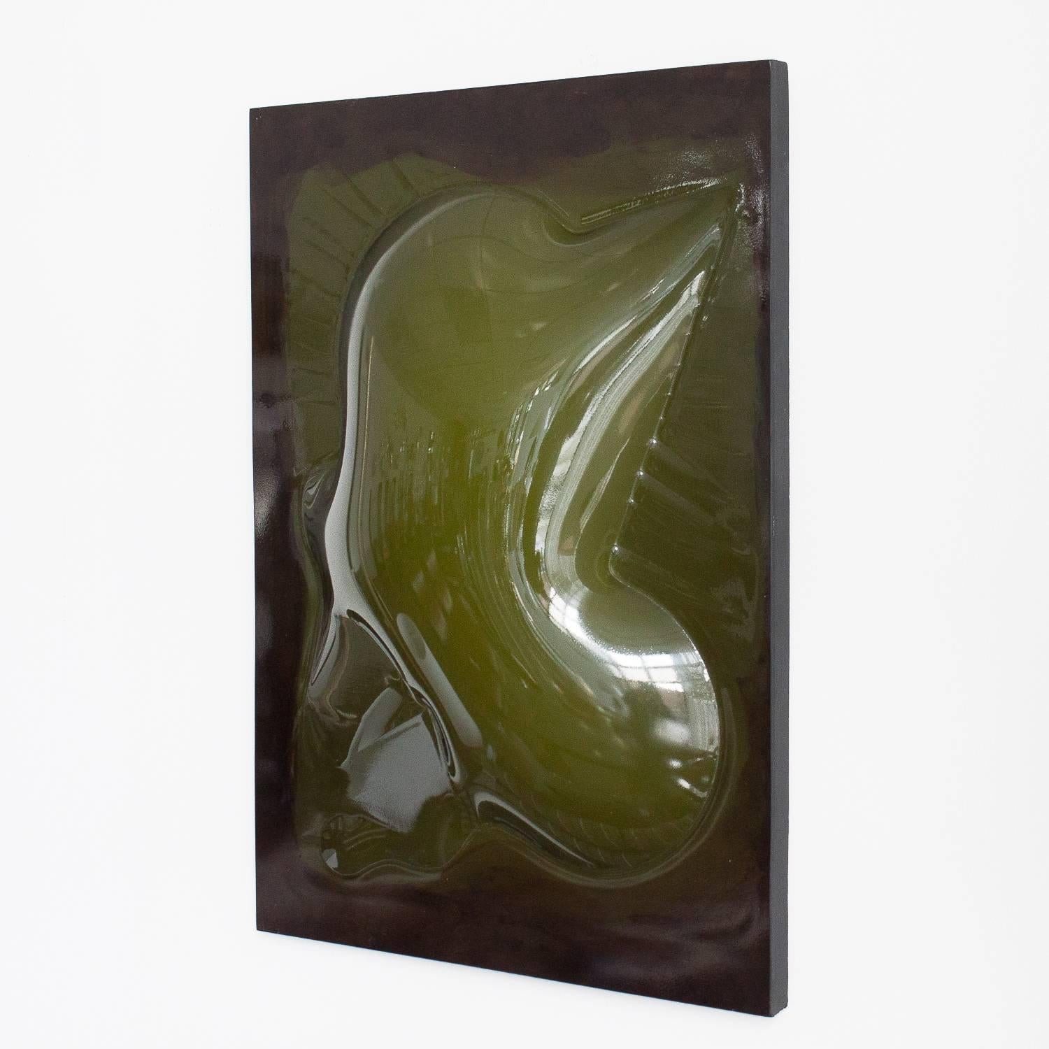 Unique 1970s vacuum formed plexi wall sculpture by artist Niel Fiertel. Abstract free-form shaped smoked acrylic / plexi sheet affixed to green painted wood backing. The raised bubbled area is clear showing the color behind. This modern artwork can