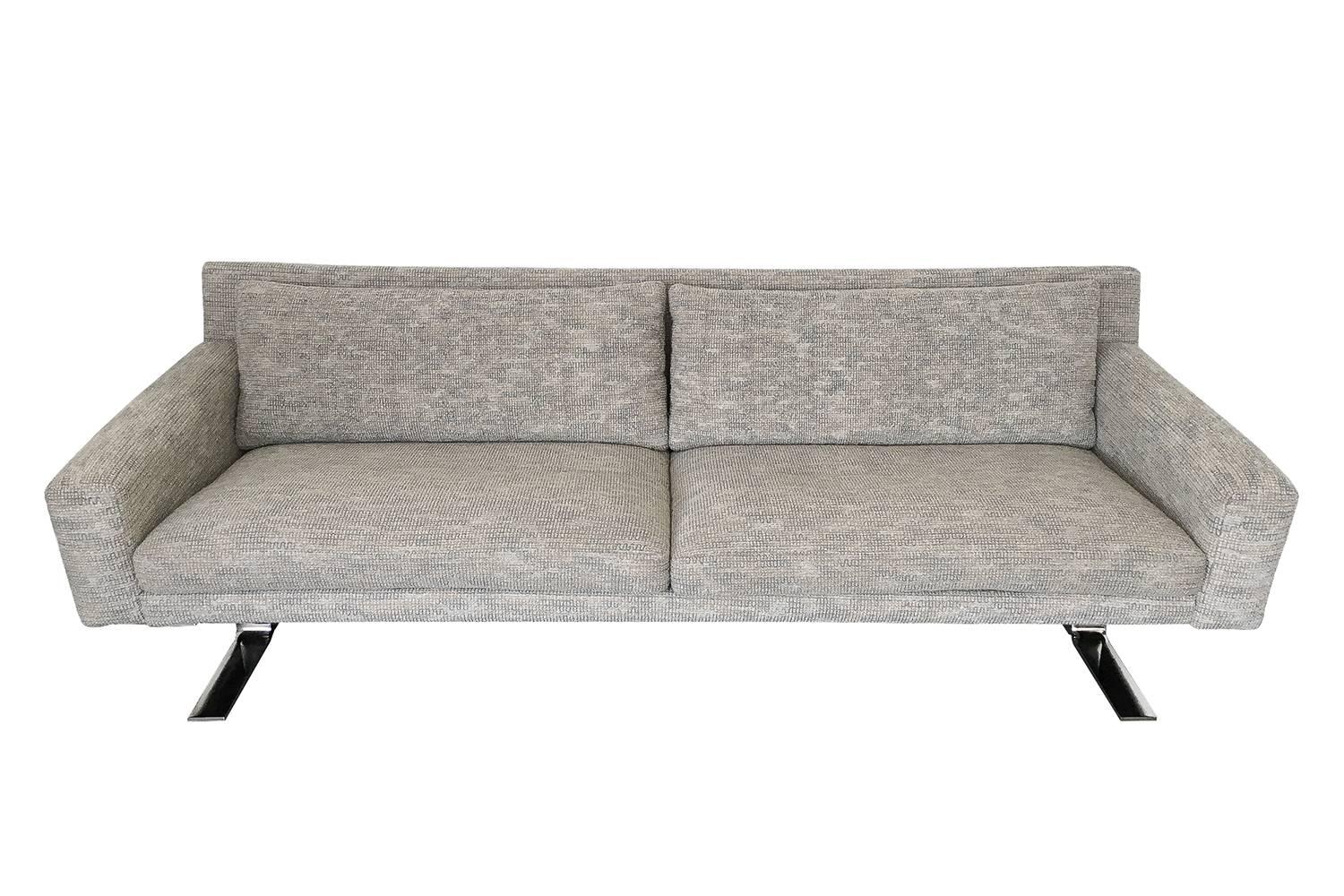 Pair of sleek chrome leg sofas by Erik Ole Jorgensen for DUX Furniture. These sofas feature chrome-plated 3