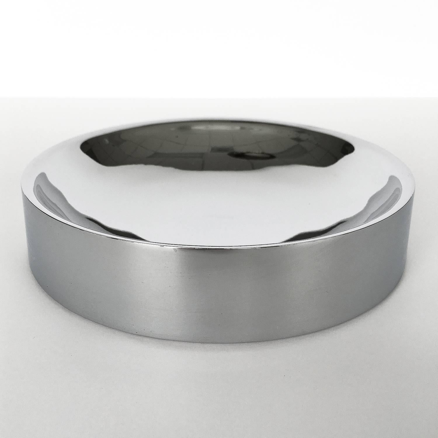 A 1970s chrome catchall bowl by TSAO Designs. Polished chrome minimal / modernist design by Warren Arthur & Mai Tsao for TSAO Designs, a well-known high concept design shop in New Canaan, CT in the 1960s-1980s. Felt bottom. Unmarked.