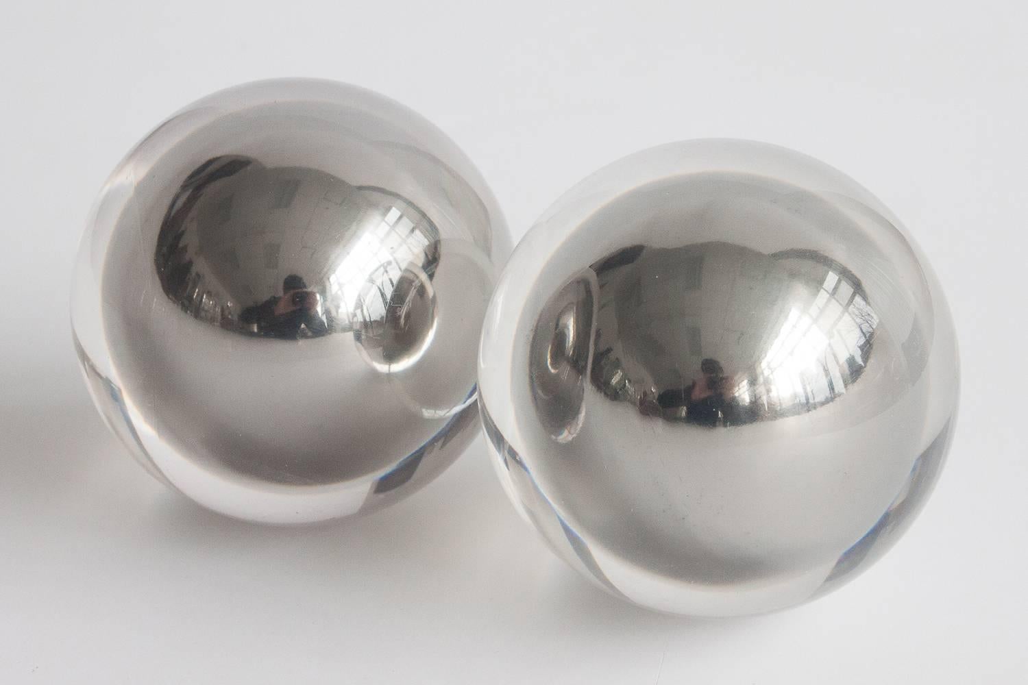 Pair of Lucite sphere sculptures. Polished steel balls encased in Lucite.

Measures: 3