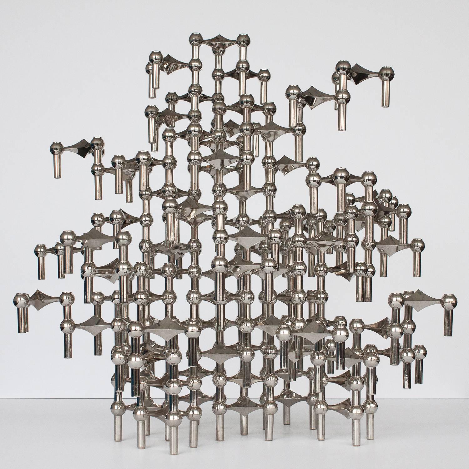A monumental sculpture made of 87 individual candleholders by Ceasar Stoffi and Fritz Nagel for BMF Germany. This modular design can be configured in an endless number of ways both vertically and horizontally by stacking each interlocking piece.
