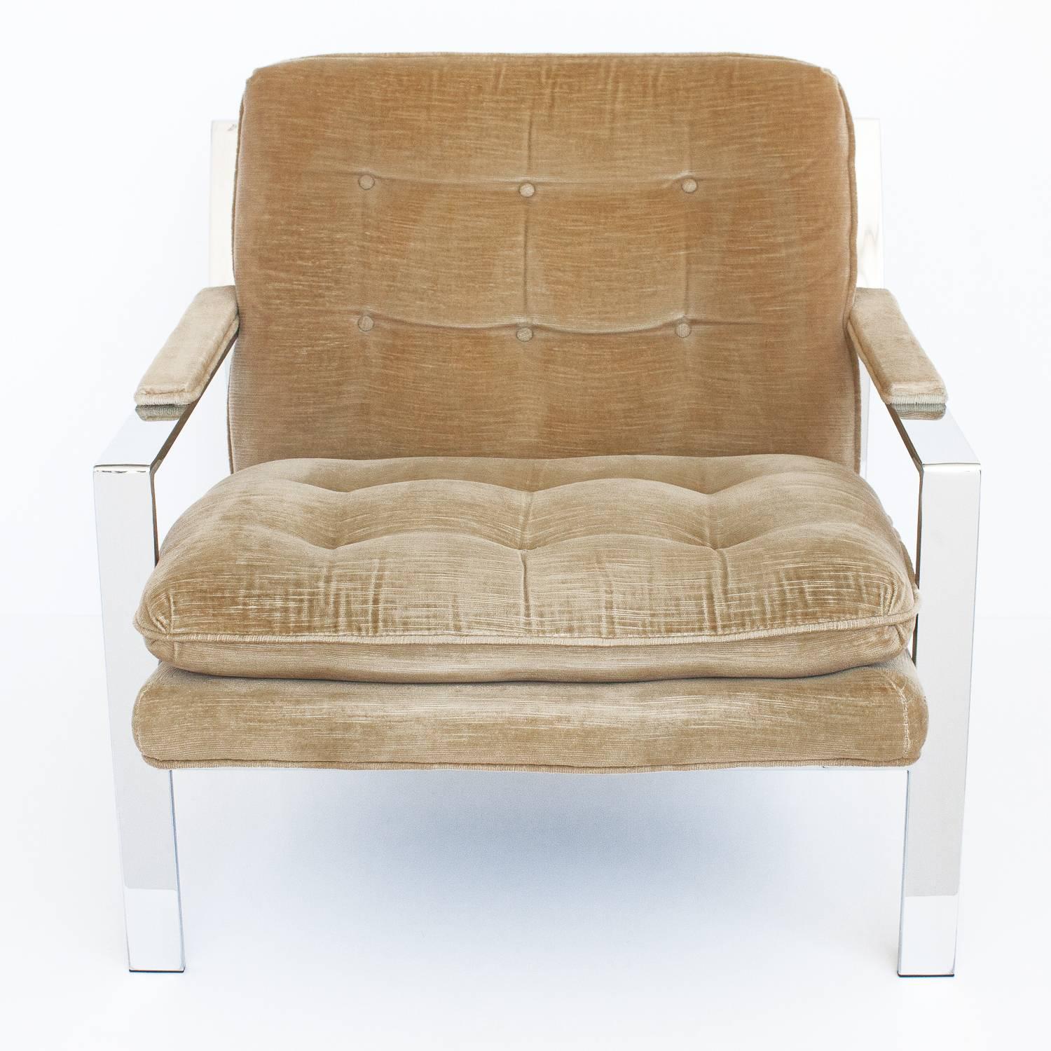 Chrome lounge chair designed by Cy Mann. The chair is upholstered in the original golden velvet fabric and re-upholstery in required. Semi attached back and seat cushions. The 2