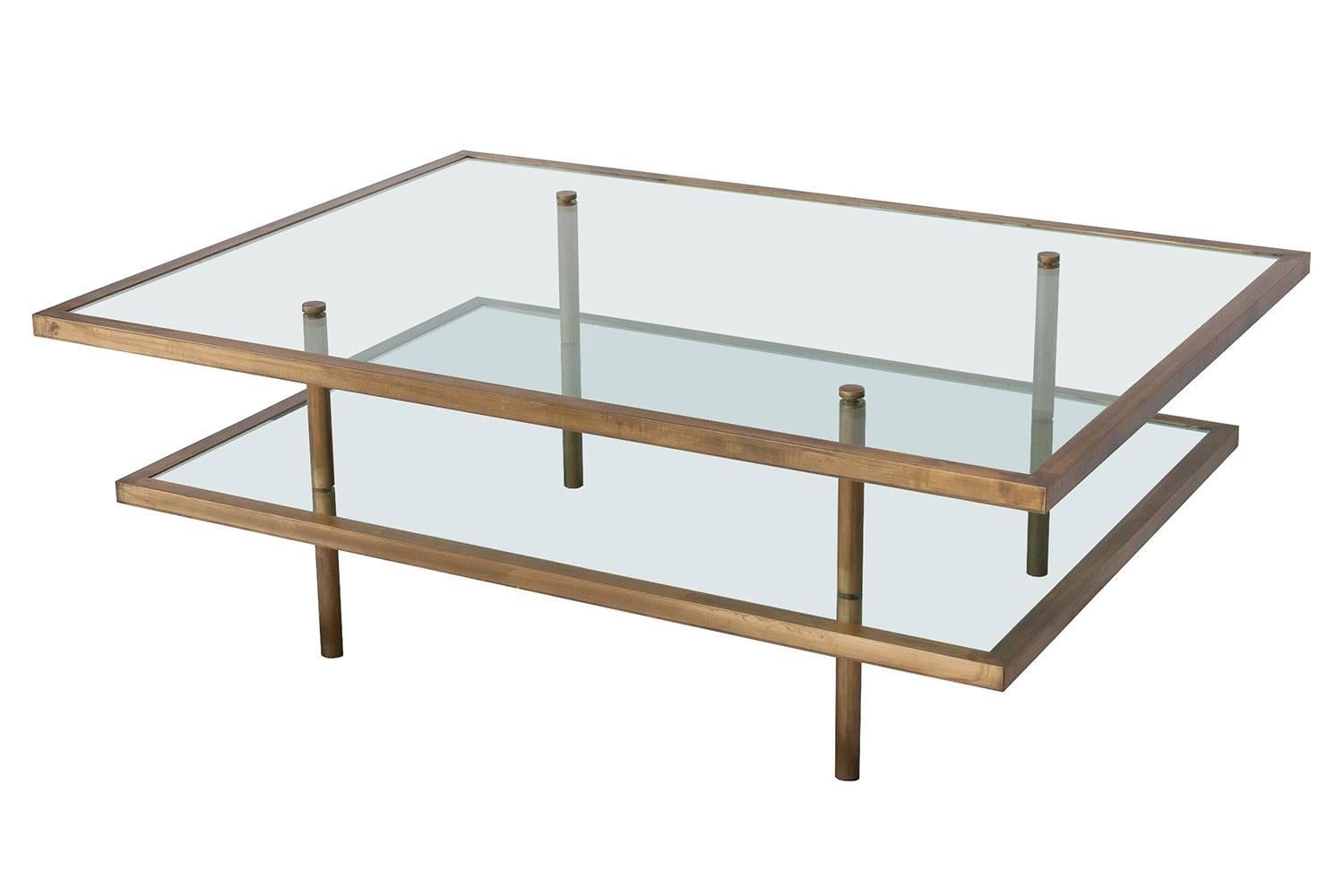 A 1960s French bronze framed glass two-tier coffee table. Glass tiers are framed in 1