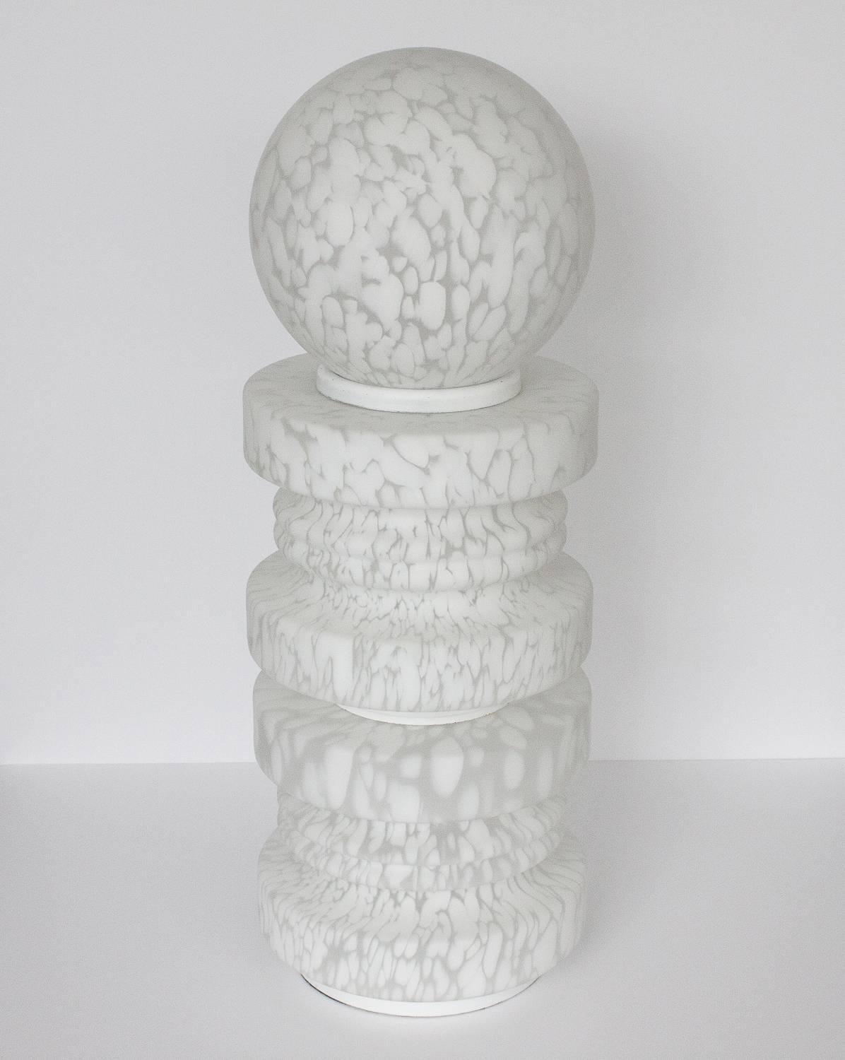 Monumental TOTEM lamp in speckled white and clear frosted / satin Murano glass by Vistosi. Three separate glass segments are separated by white enameled metal spacers. Suitable for floor or table. The lamp takes one standard base light bulb in the