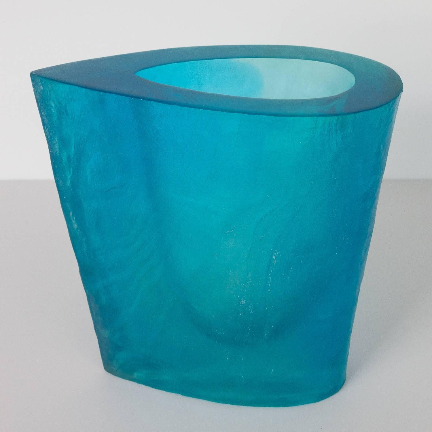 Aqua blue polymer resin optical sculpture vase by Terry Balle. Textured exterior and interior with a polished rim surface. The texture has a subtle faux bois ripple pattern and 