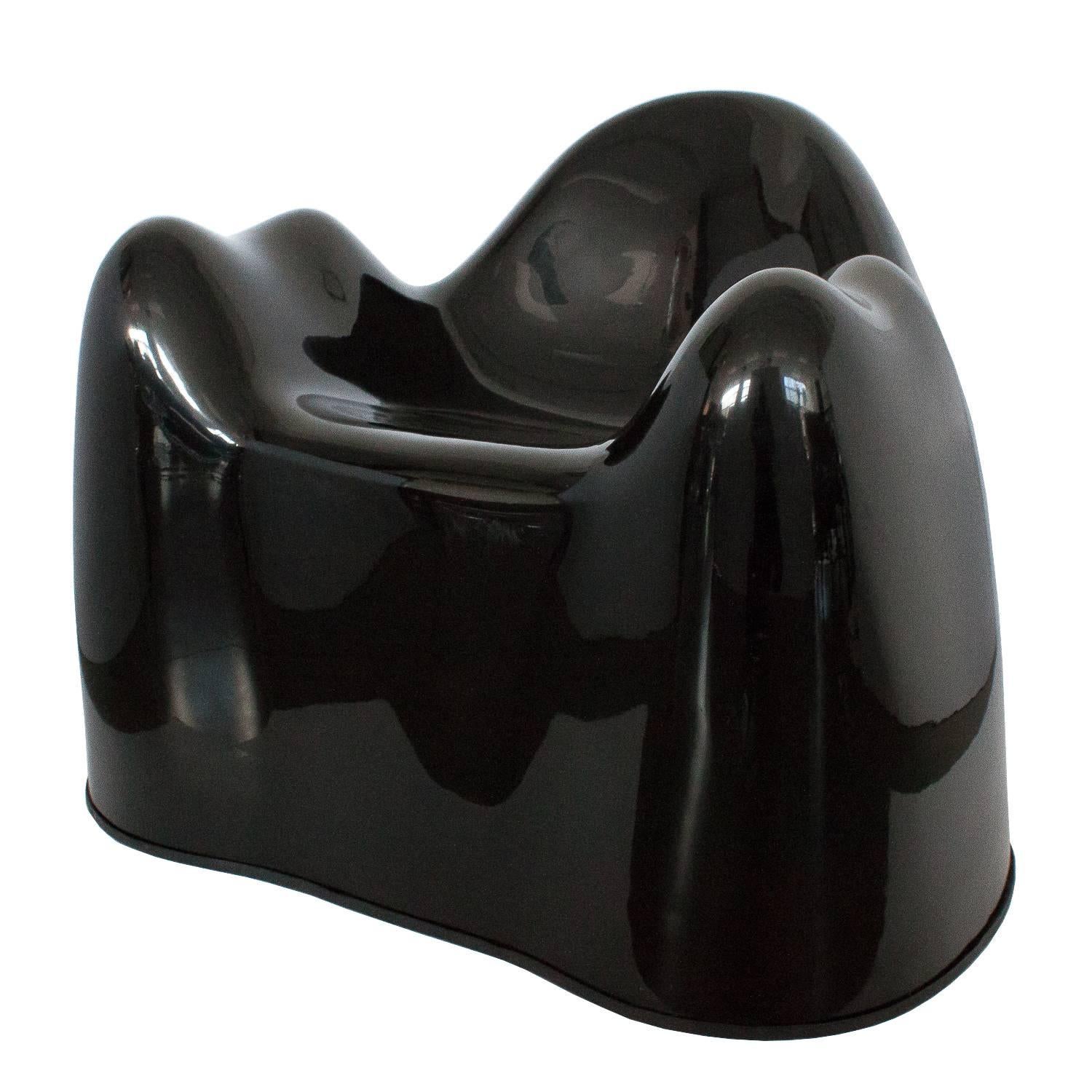 Rare pair of black molar chairs by Wendell Castle, circa 1969 and distributed by Beylerian. The chairs are comprised of gel-coated fiberglass reinforced plastic. A stunning and sculptural iconic piece of design. These chairs were part of the