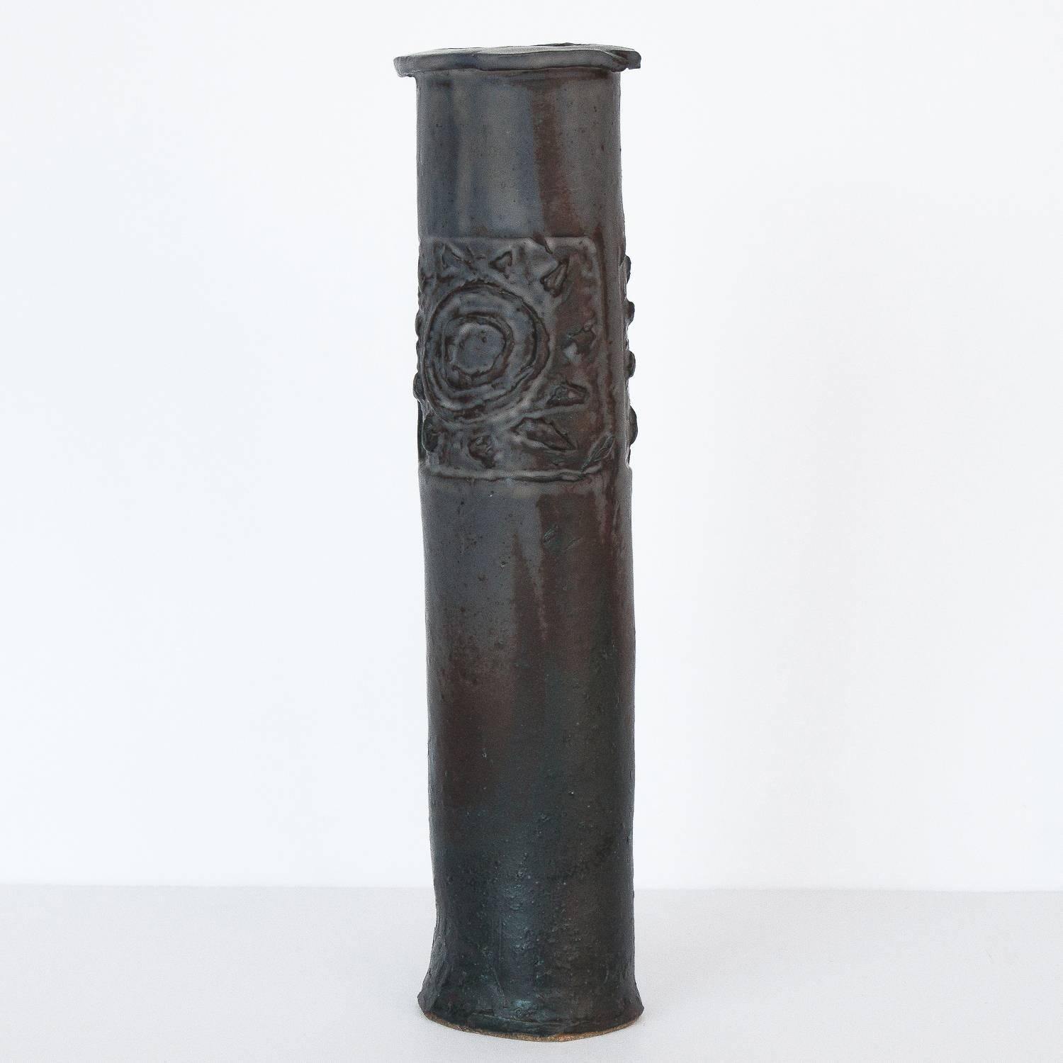 Brutalist Studio Pottery vase by Ethel "Eppie" Potts. Tall narrow slab style vase with abstract sun motif on both sides. Gray, brown and dark green glaze. Signed Kudrna, her Czechoslovakian maiden name.