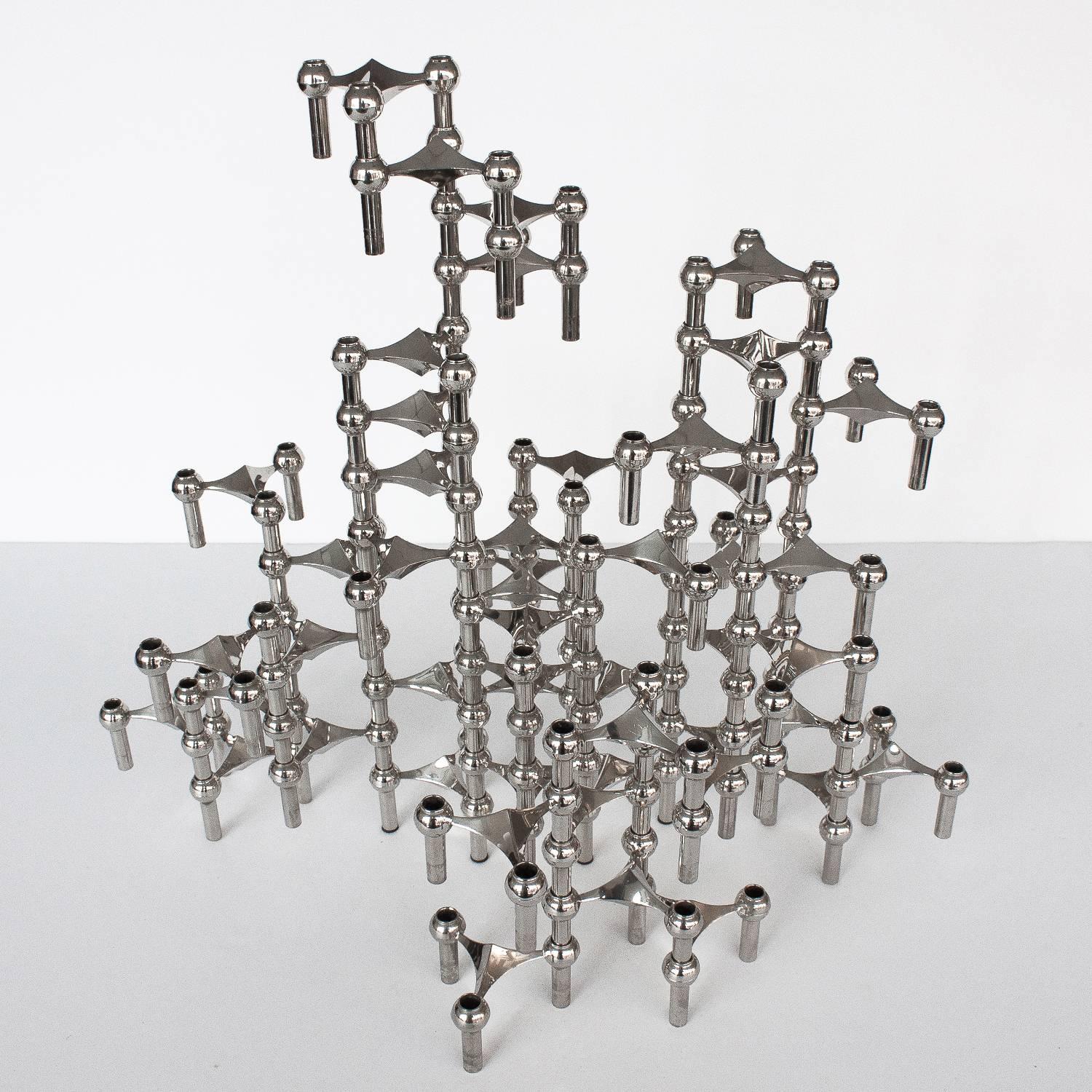 A sculpture made of 50 individual candleholders by Caesar Stoffi and Fritz Nagel for BMF, Germany. This modular design can be configured in an endless number of ways both vertically and horizontally by stacking each interlocking piece. Perfect as a