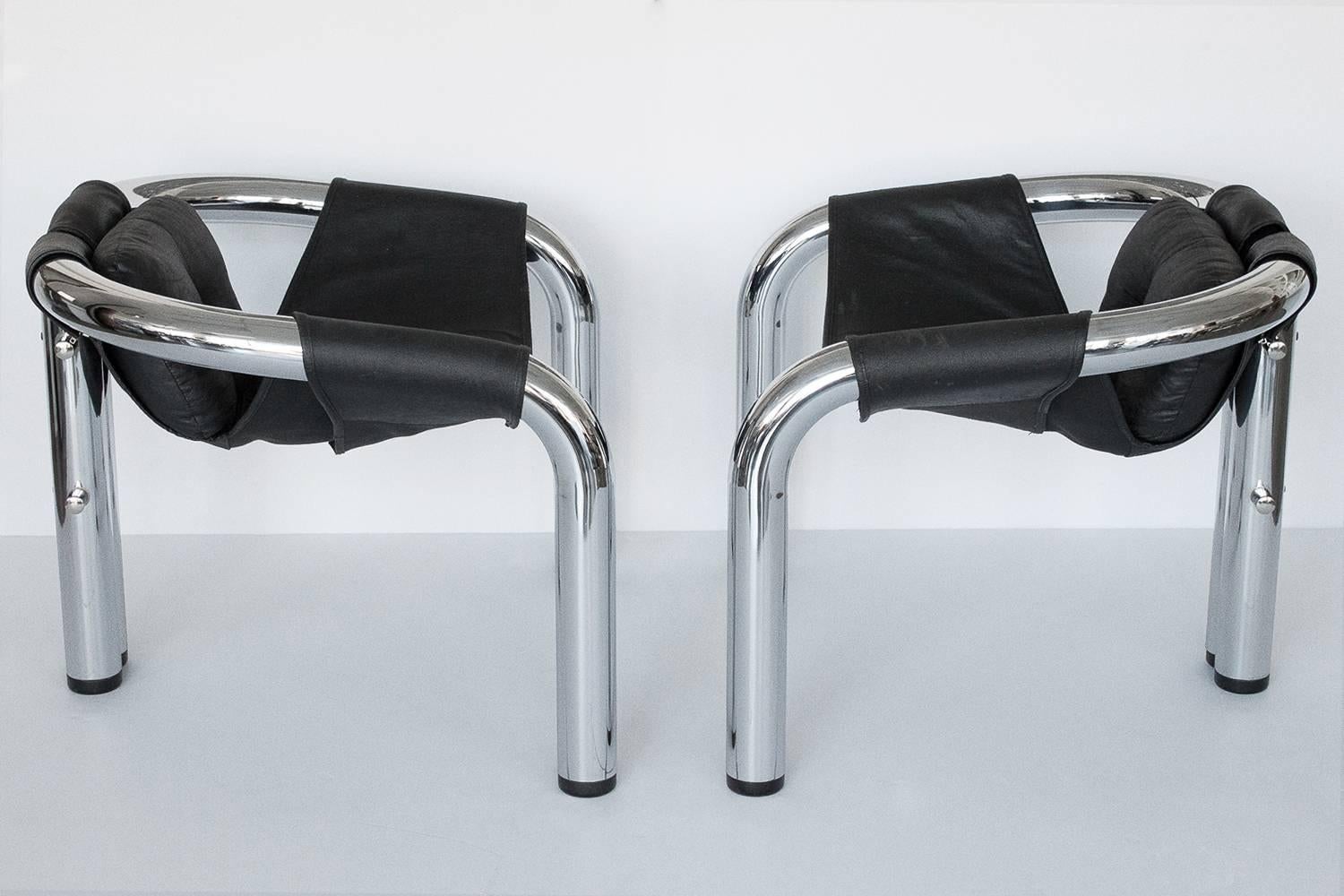 Pair of Palo Alto lounge chairs designed by Byron Botker for Landes Manufacturing Company, 1974. Comprised of 3 inch diameter chrome-plated steel tubular frame with sling seat and pillow. Black canvas sling upholstery with black vinyl facing.
