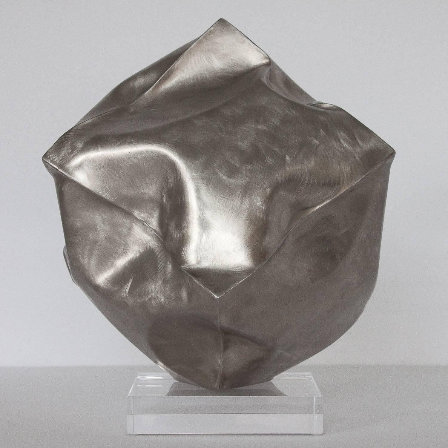 Abstract deflated / crumpled steel cube sculpture by Richard Baronio, circa 1973. Unusual form and striking form all angles. Signed and dated by the artist. Sculpture is resting on a 6