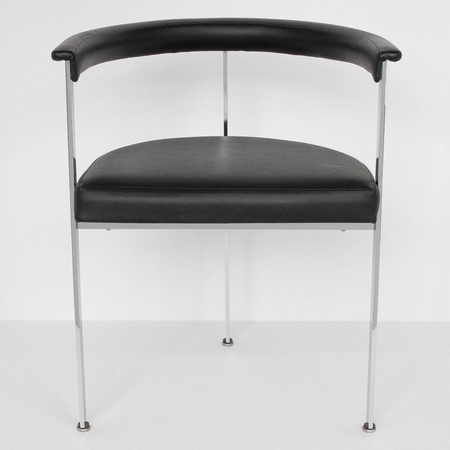 Set of four-three legged modern dining chairs. Chrome-plated solid steel construction. Measure: 1.25