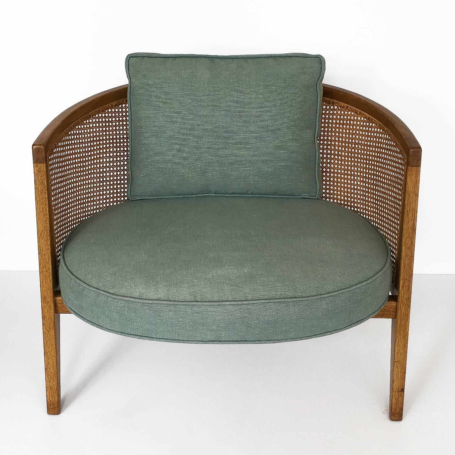 Harvey Probber hoop back lounge chair, model 1066, circa 1950s. Angular mahogany frame and woven curved cane back. Original sea-foam colored fabric upholstery with down filled loose back cushion. Original finish with no restoration. General wear and