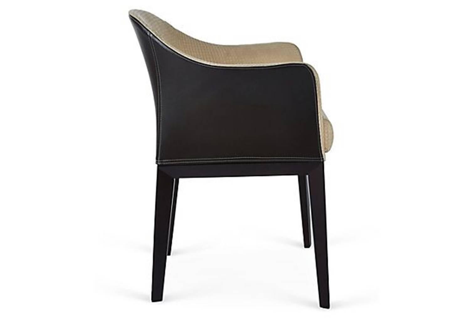 Giorgetti Normal armchair in combination of leather and fabric.