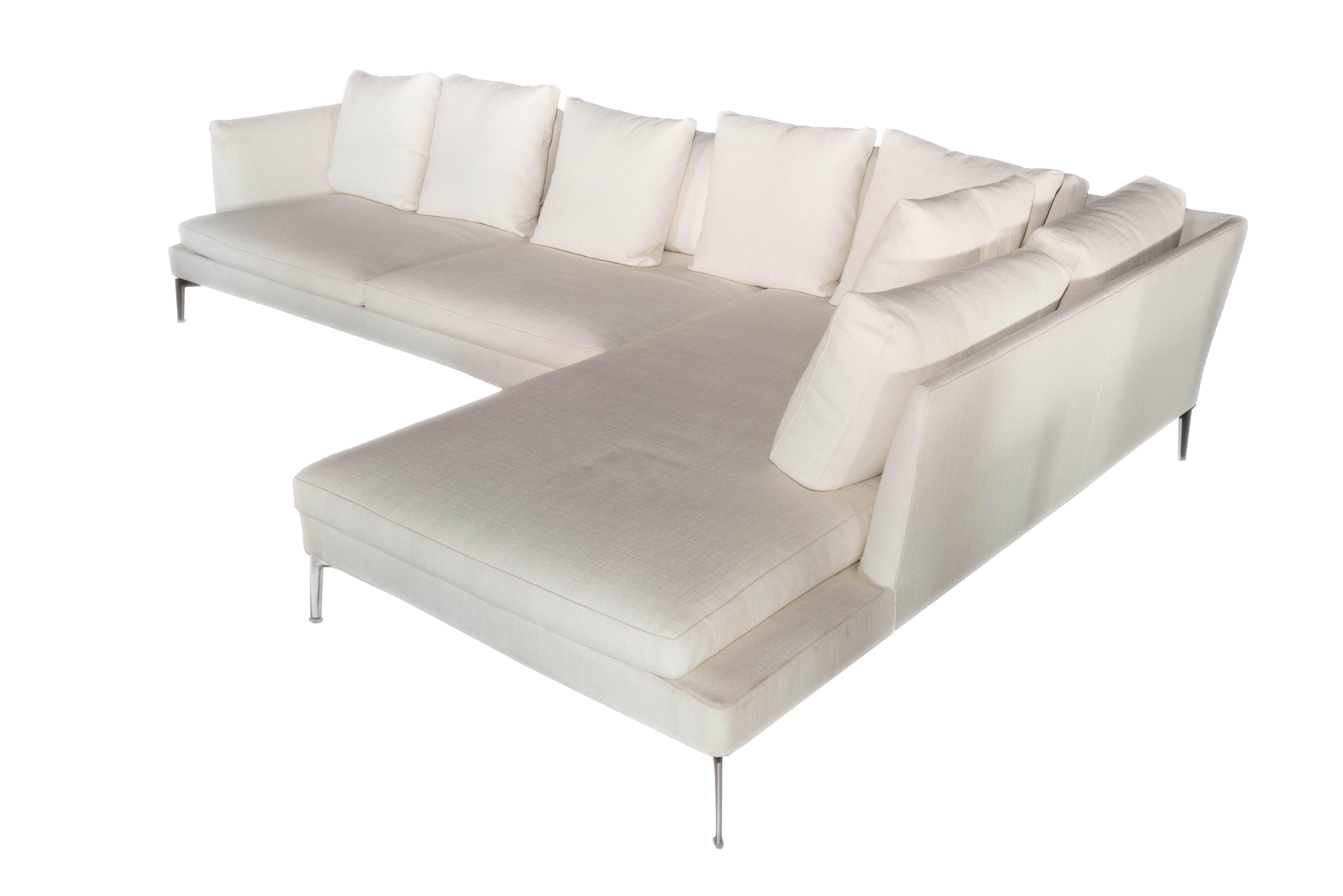Seat: Frame structure metal covered with leather.

Arms and back: Wood with polyurethane and dacron padding covered with a protective fabric lining. 

Seat cushions: Polyurethane and dacron back down.

Foot: Aluminium.

About the