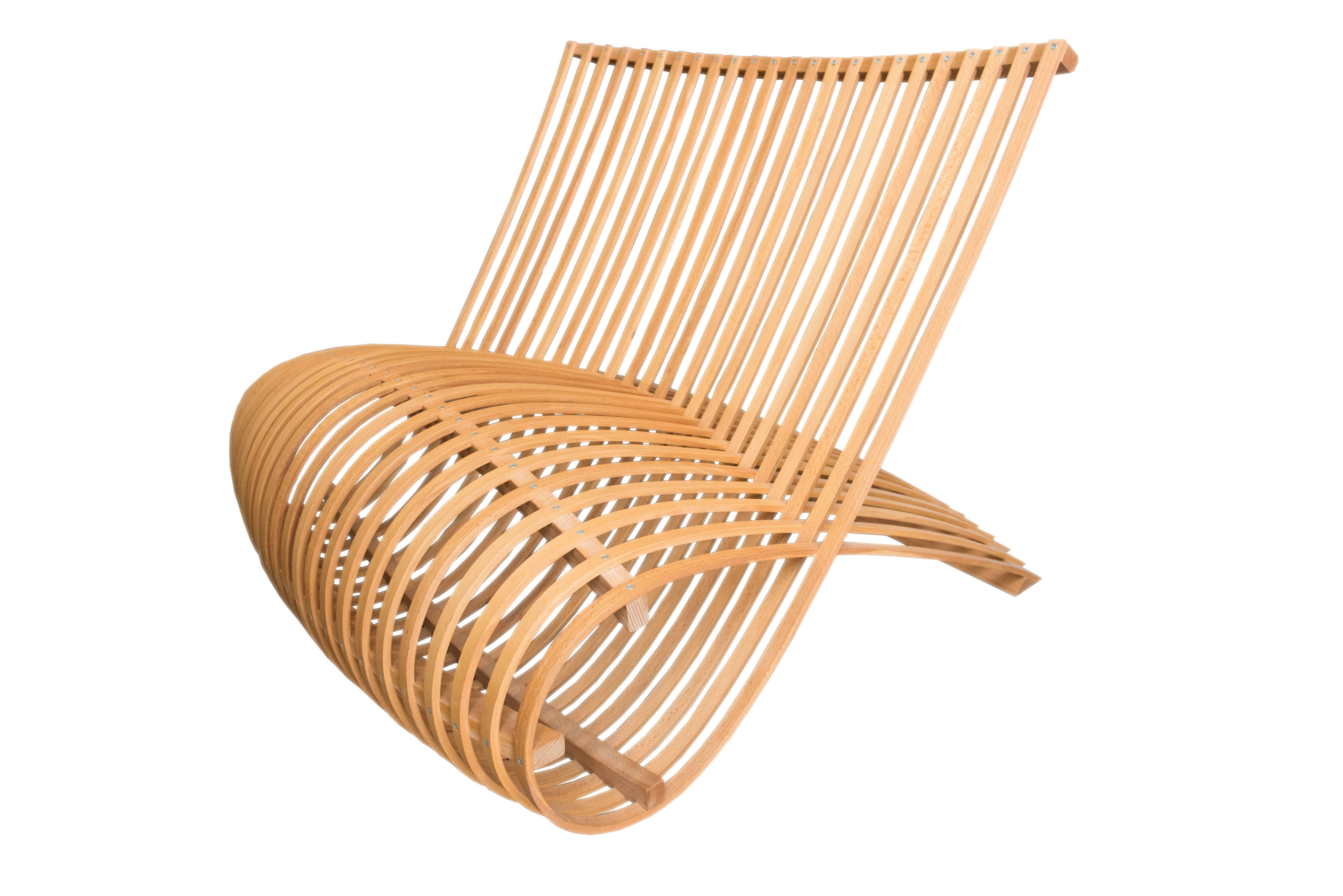 Small armchair manufactured in bent natural beech heartwood.

About the Designer
Marc Newson

Born in Australia in 1963, Marc Newson worked around the world, first in Tokyo, then in Paris and finally in London where he, along with Benjamin de
