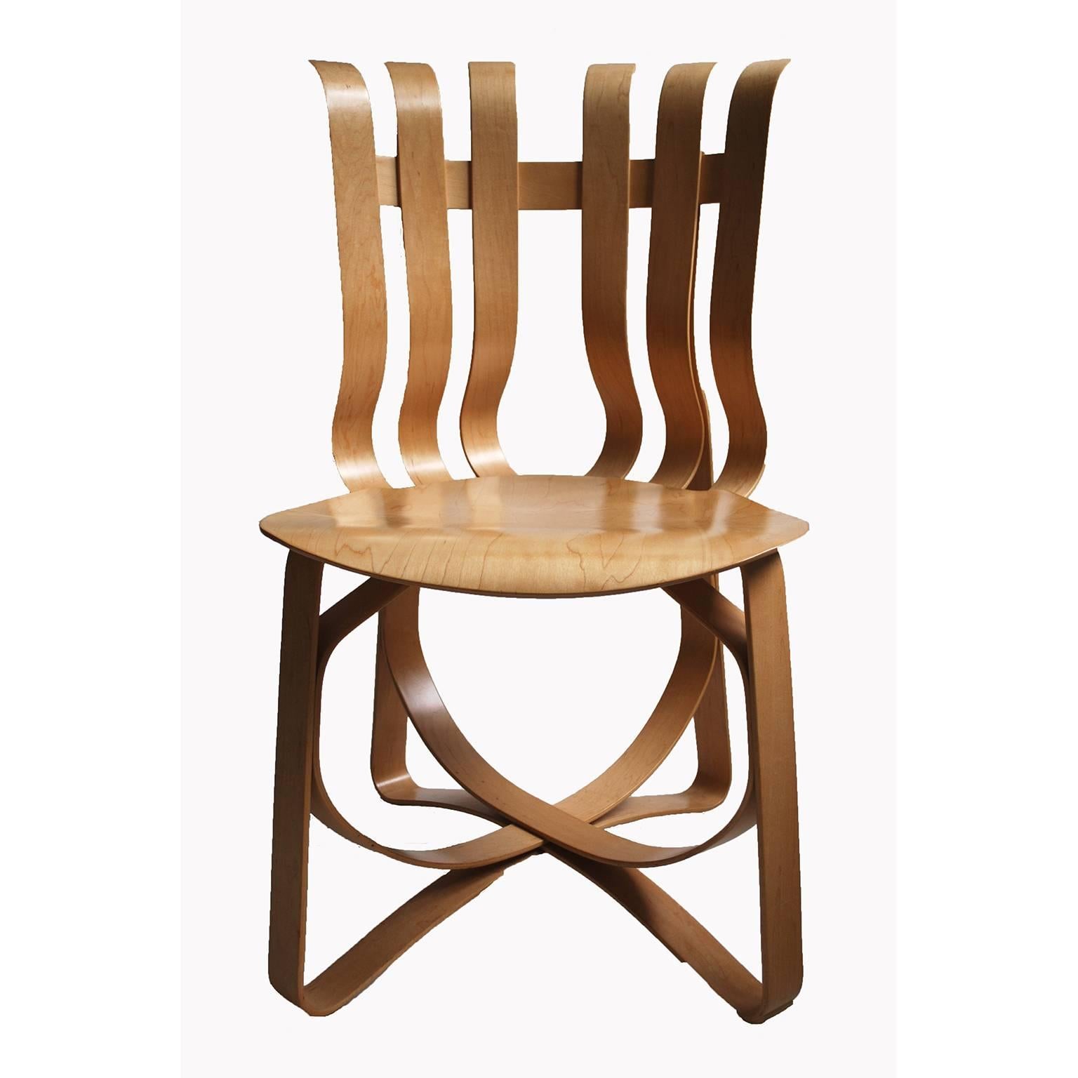This chair design comes from world renowned architect Frank Gehry, FAIA. Constructed of laminated white maple veneer strips that flex for comfort. The underside of each chair is embossed with the date of production, Knoll Studio logo and Frank