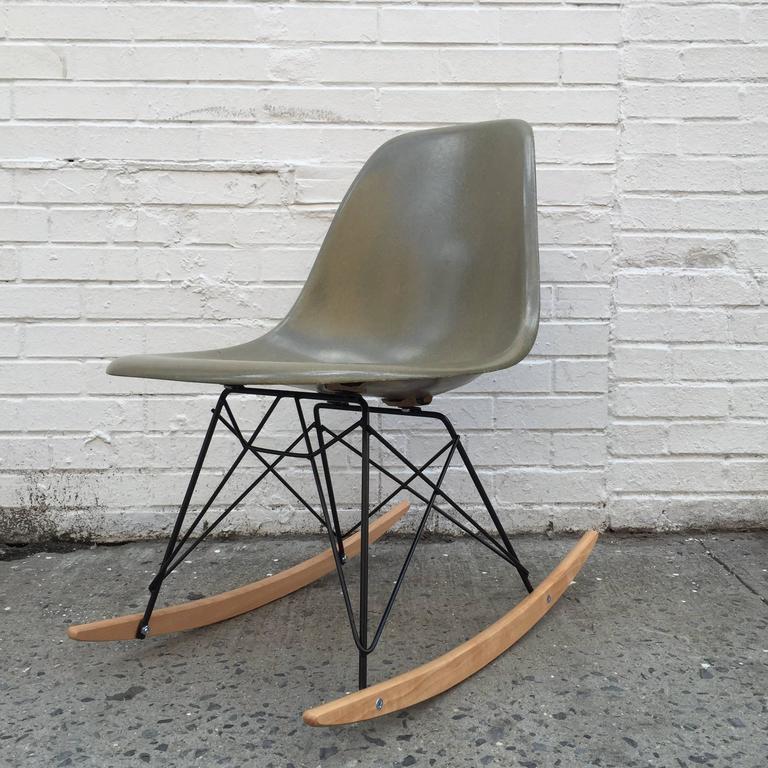 Eames Herman Miller shell on a new base in rare color raw umber. Excellent condition. Base available with chrome metal for no additional charge.