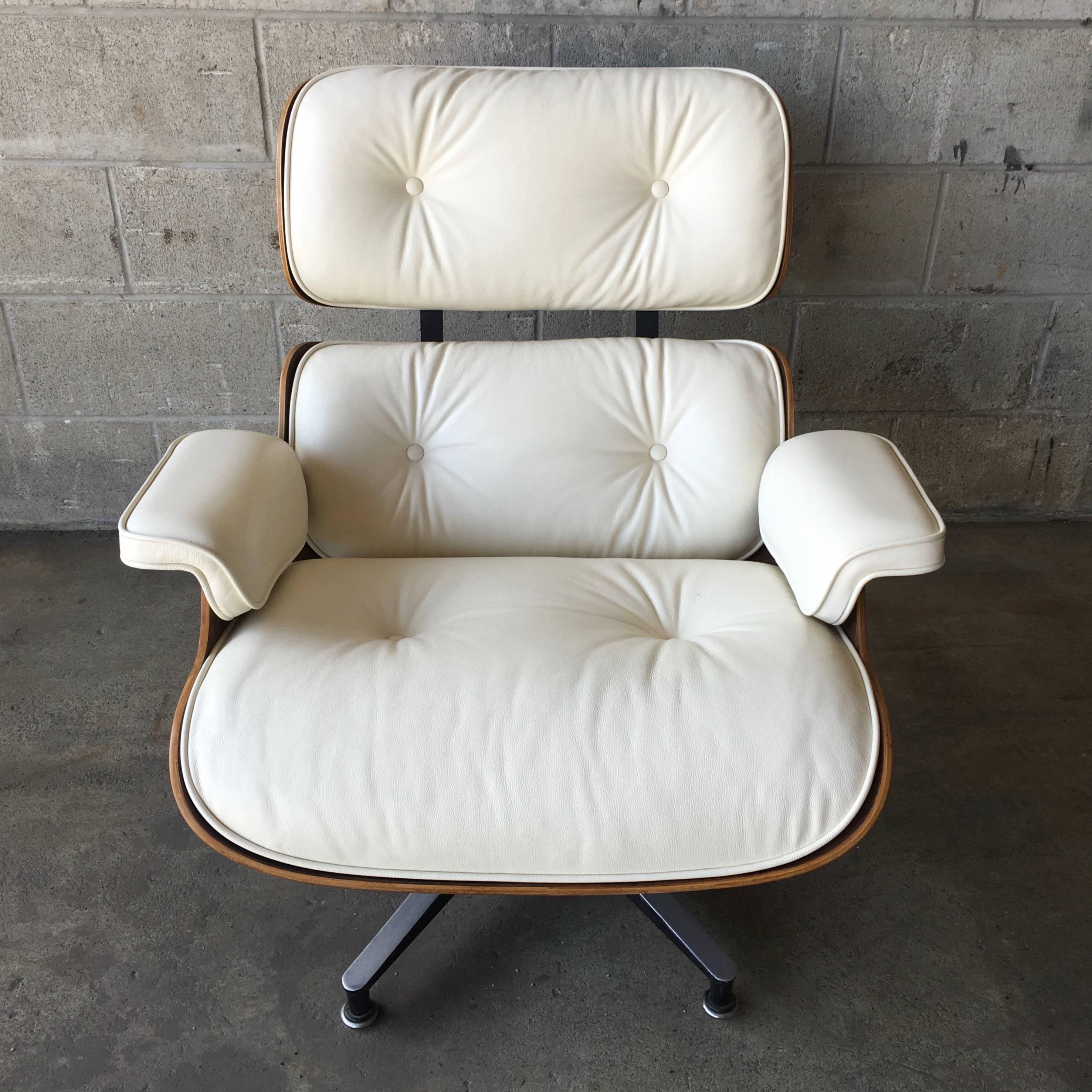 Herman Miller Eames lounge set. Lounge chair and ottoman in Brazilian rosewood and cream leather. Cushions are new. The rosewood shells are professionally refinished. These cushions are made to order and require a 2 week production time. 