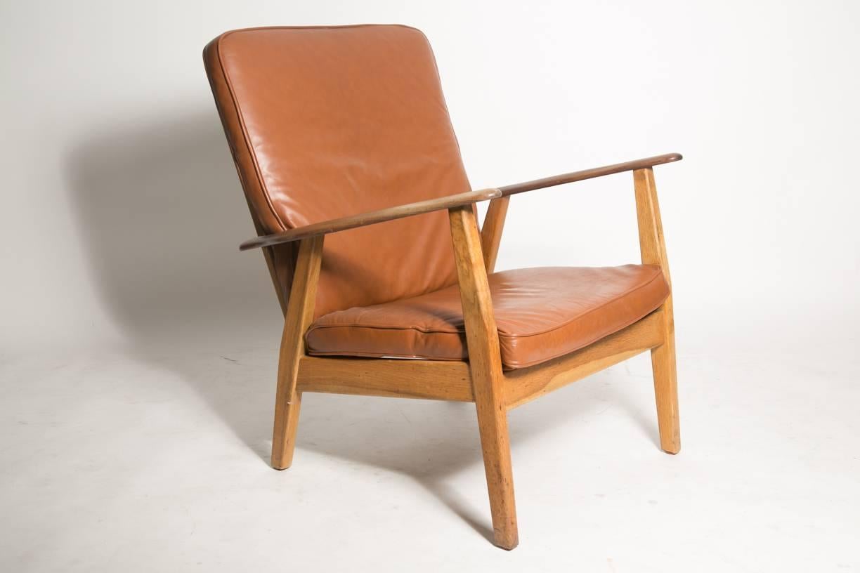 Hans Wegner attributed Burmese teak cigar armchair with tawny brown leather cushions. Dense grain to the wood. Original cushions have been replaced with Stouby cushions. inner seat frame has been damaged and repaired by the previous owner.